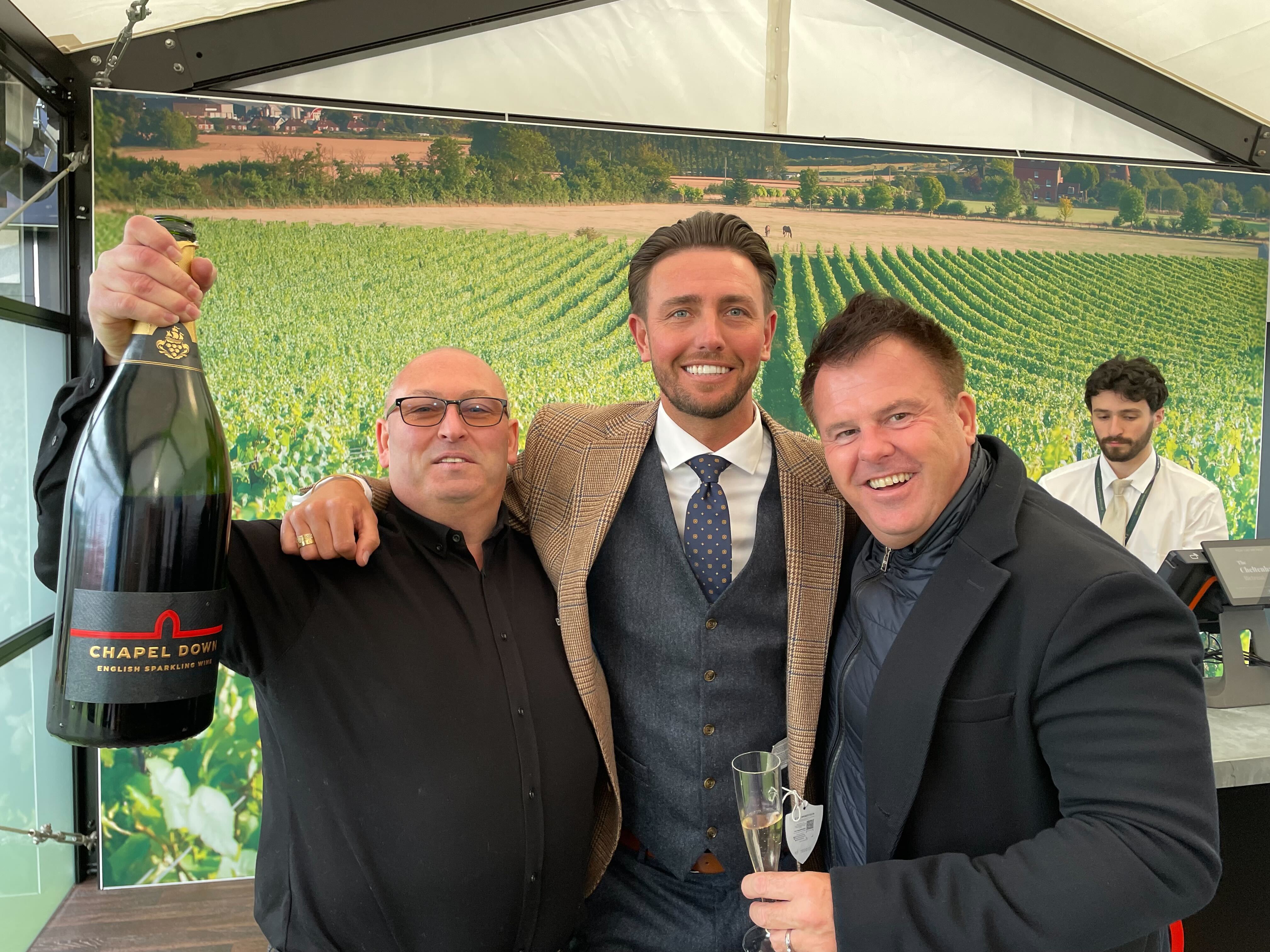 Revelers enjoy a £290 bottle of English sparkling wine at the Cheltenham Festival. (From left) Mark Unsted, Bradley Larimore and Shaun Hogg