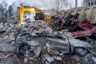 Rescuers clear the rubble of an apartment building following Russia's missile attack in Kharkiv, Ukraine, Saturday