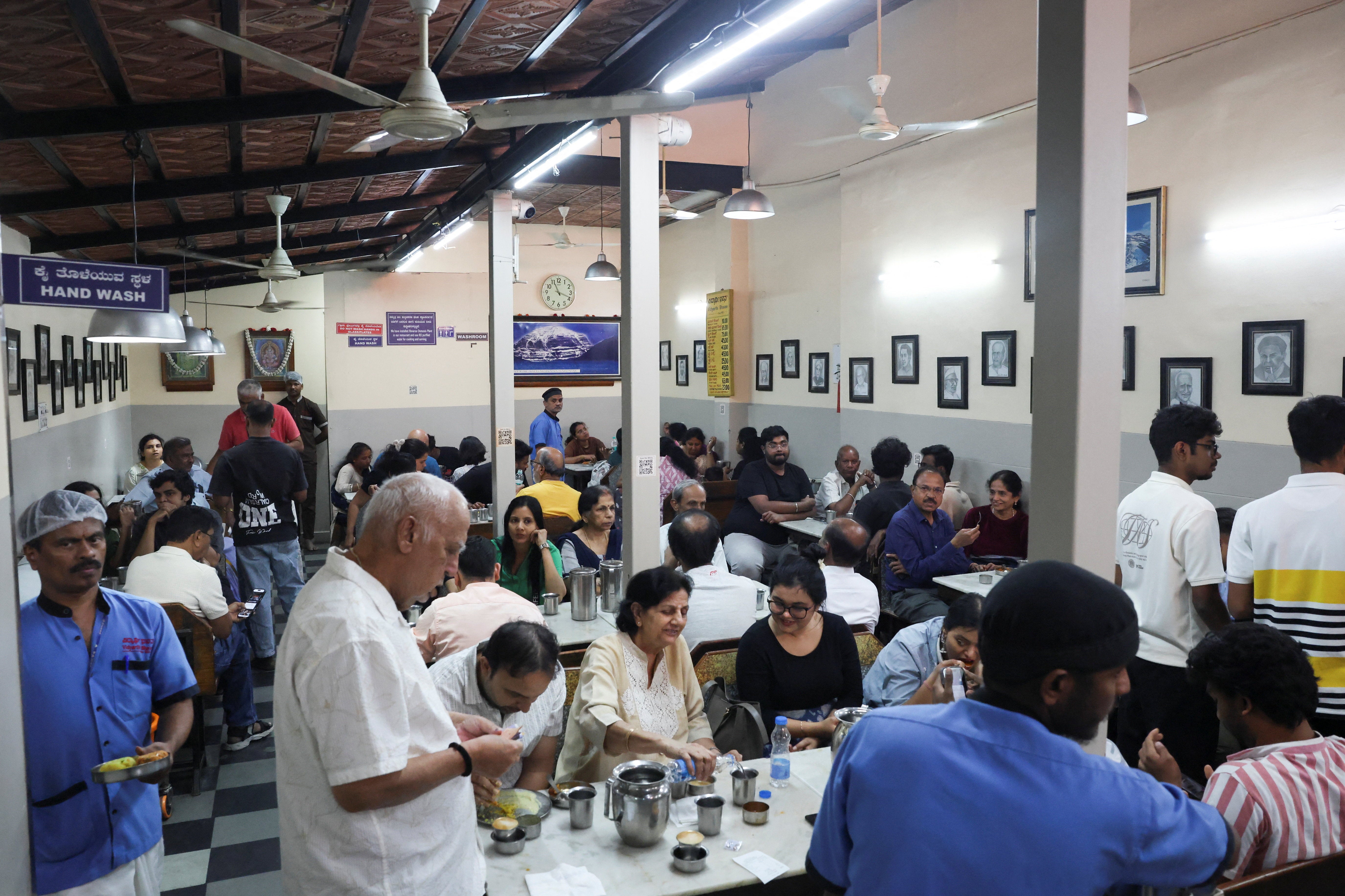 Customers dine inside Vidyarthi Bhavan restaurant, as restaurants and hotels in southern India, including the IT hub of Bengaluru, have warned of shutdowns amid disruptions in commercial LPG supply