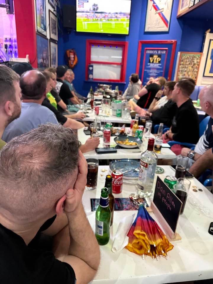 Drinkers inside the Ibrox Bar in Benidorm watch one of the races on the opening day of the Cheltenham Festival