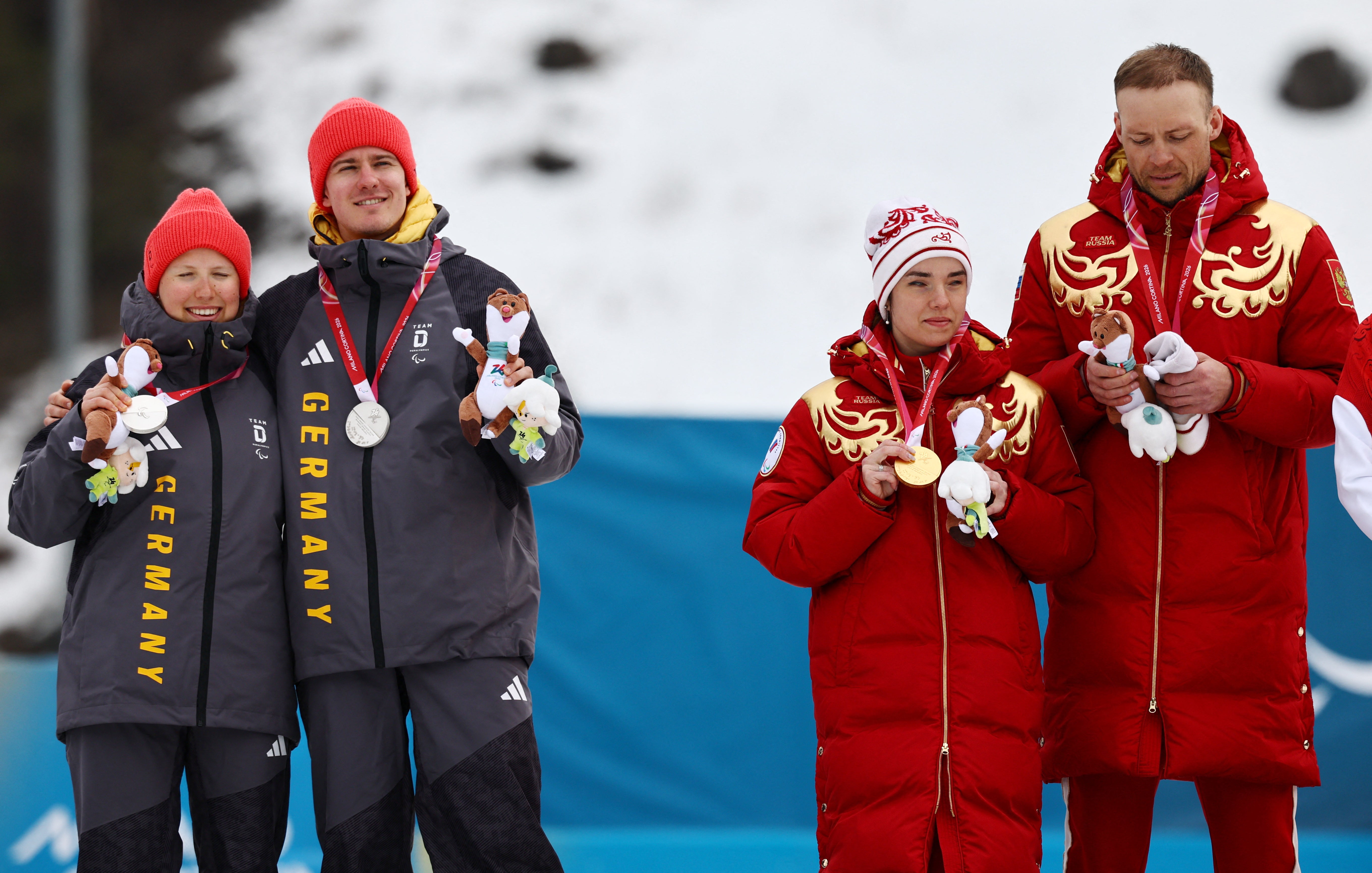 Germany's skiers turned their backs and kept their hats on during Tuesday's ceremony