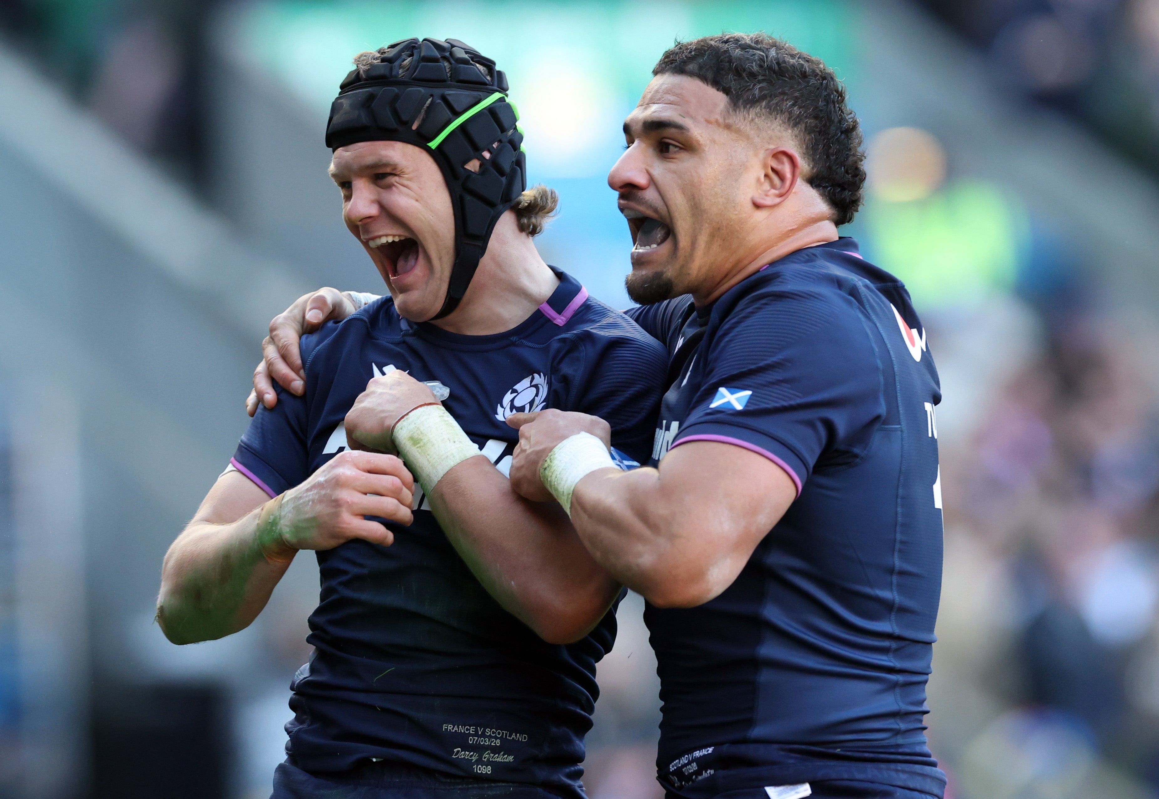 Darcy Graham of Scotland celebrates scoring his team's sixth try with teammate Sione Tuipulotu during the Guinness Six Nations 2026 match between Scotland and France
