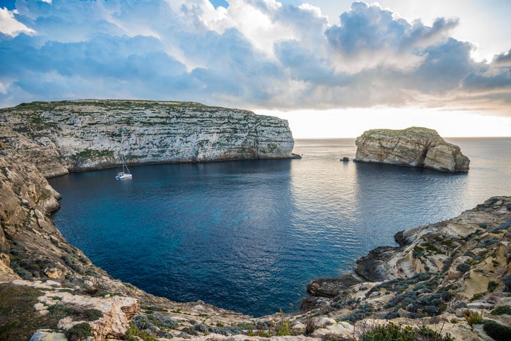 Dwejra Bay on Gozo’s photogenic west coast is guarded by 200-foot-tall Fungus Rock
