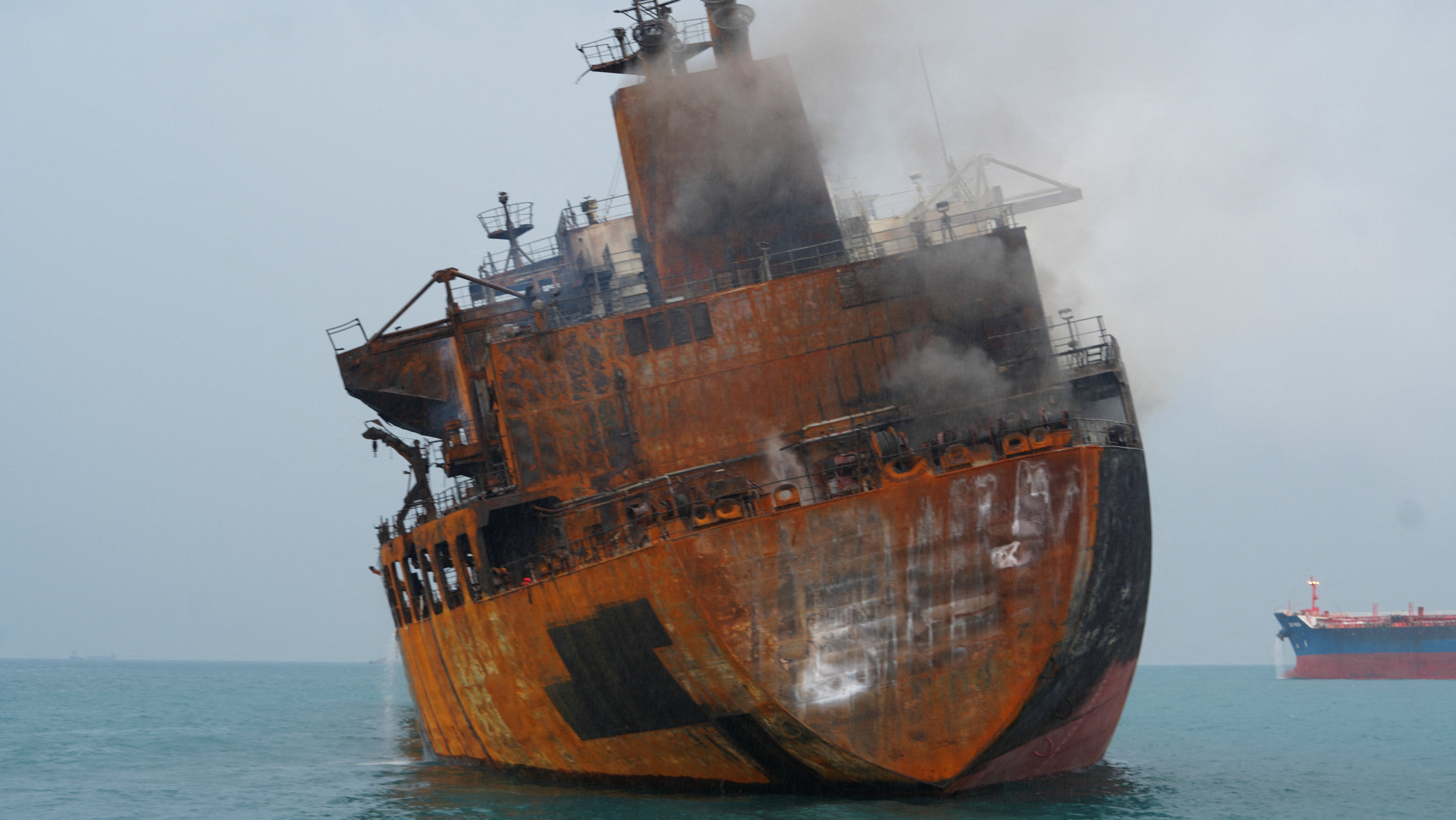 One of the ships that caught fire following attacks off the coast of Iraq late on Wednesday