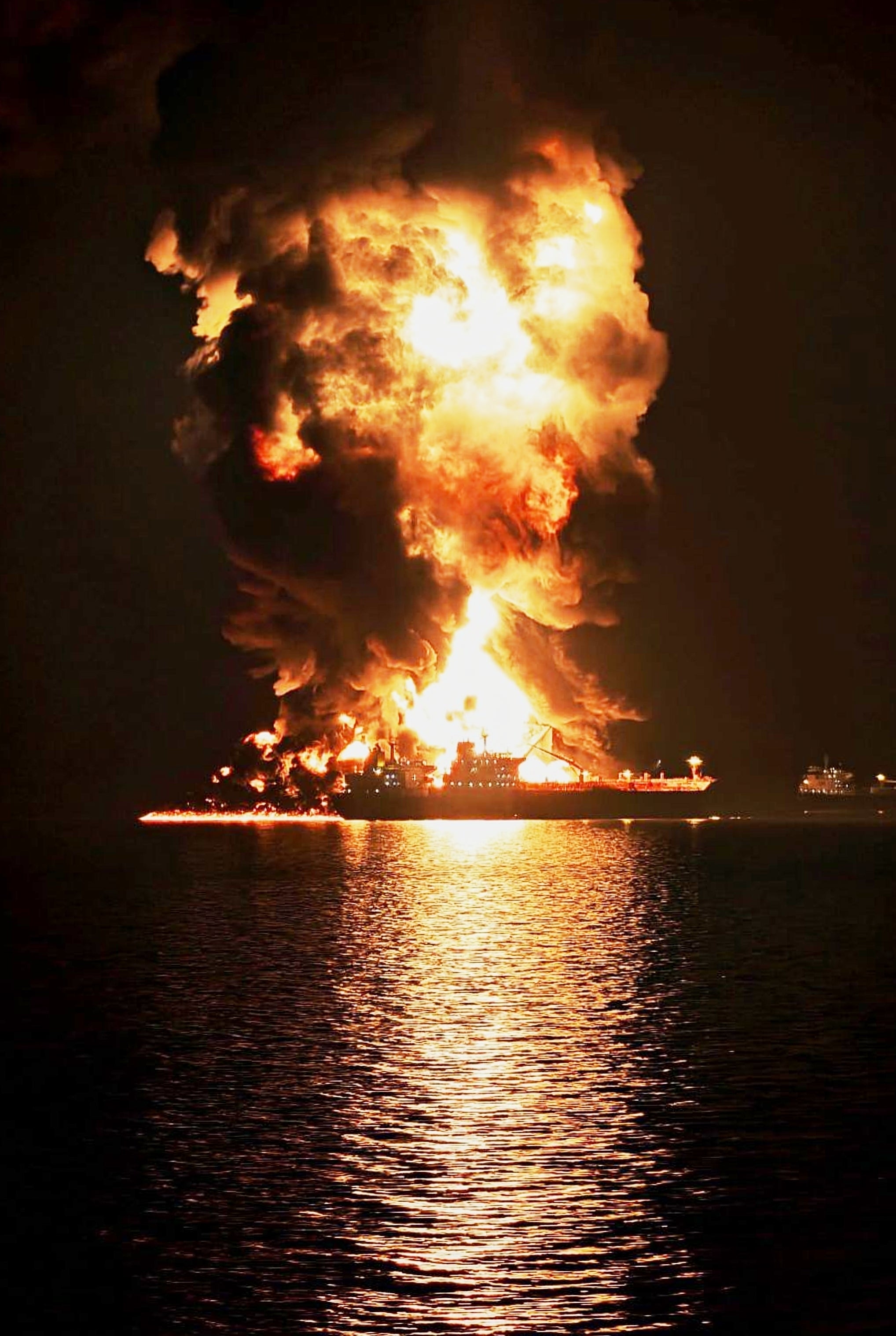 An oil tanker burns after getting hit by an alleged Iranian projectile at Khor al-Zubair port near Basra, Iraq, on 11 March 2026