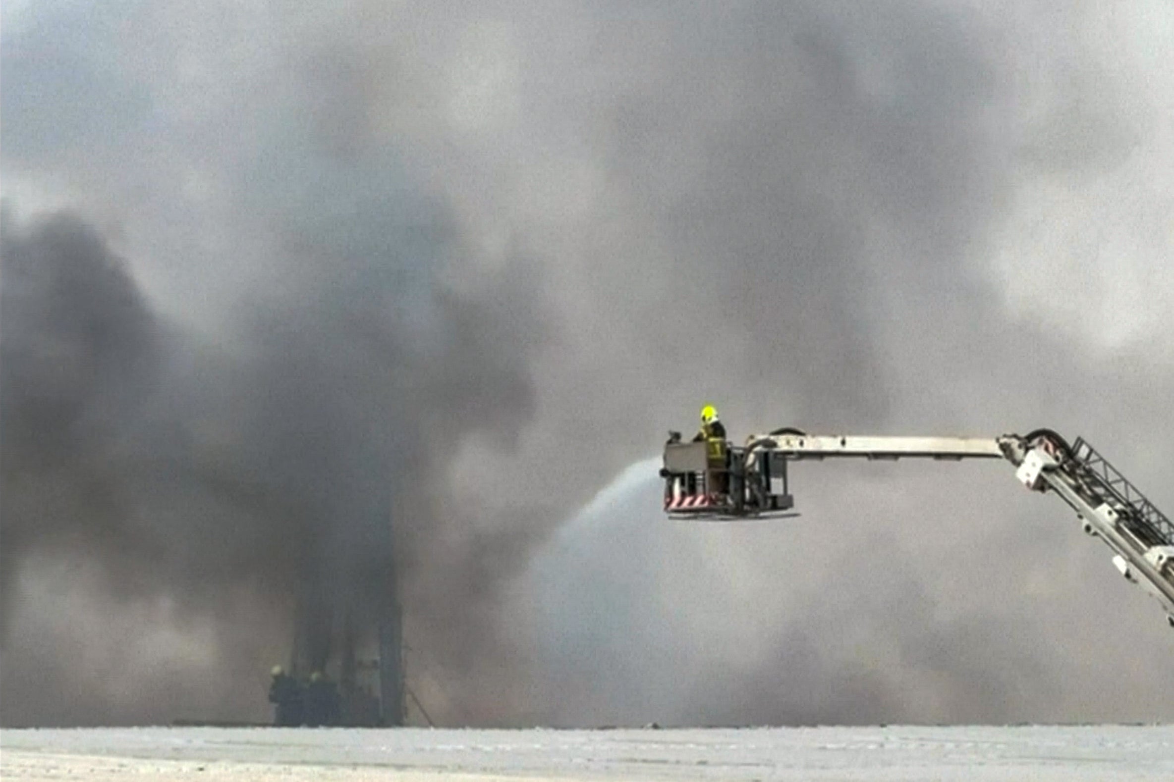 Firefighters work to tackle the fire on Friday morning