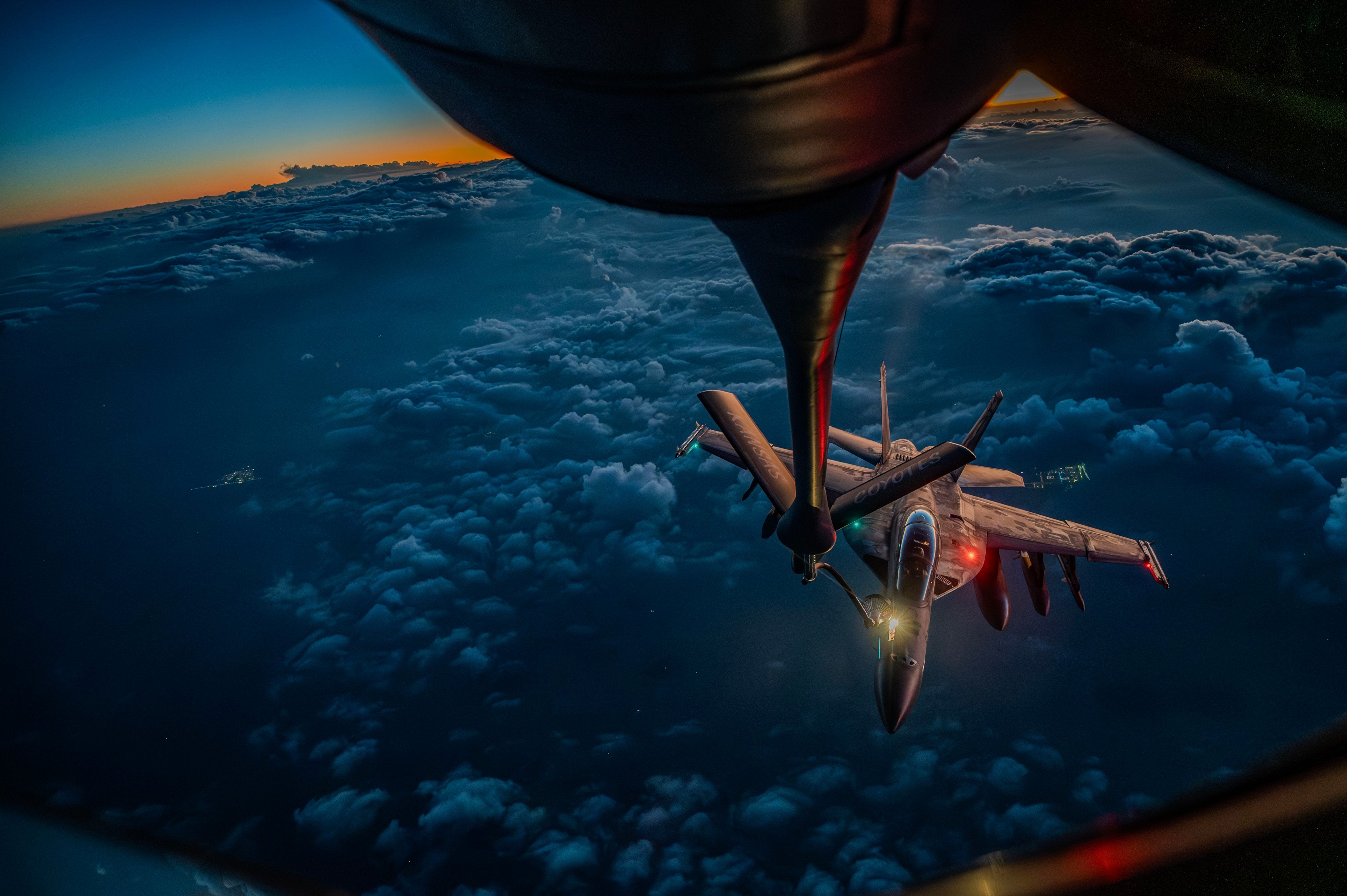 US Centcom KC-135 Stratotanker refuels a U.S. Navy F/A-18F Super Hornet over the middle east during Operation Epic Fury (file)