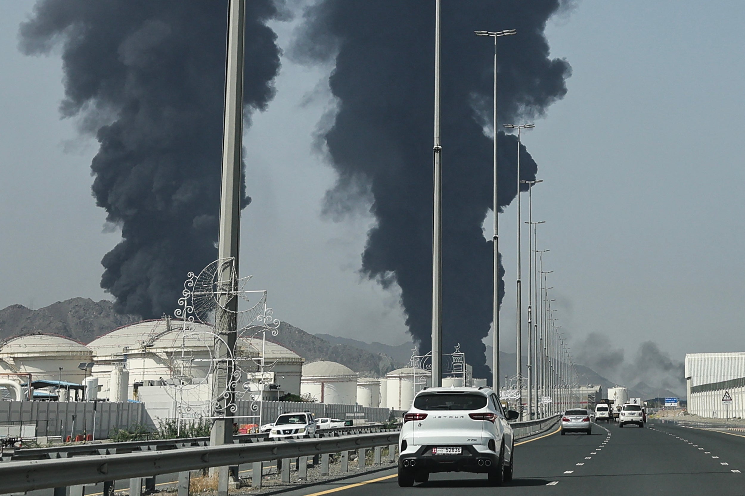 Smoke rises from the direction of an energy installation in the Gulf emirate of Fujairah on March 14, 2026.