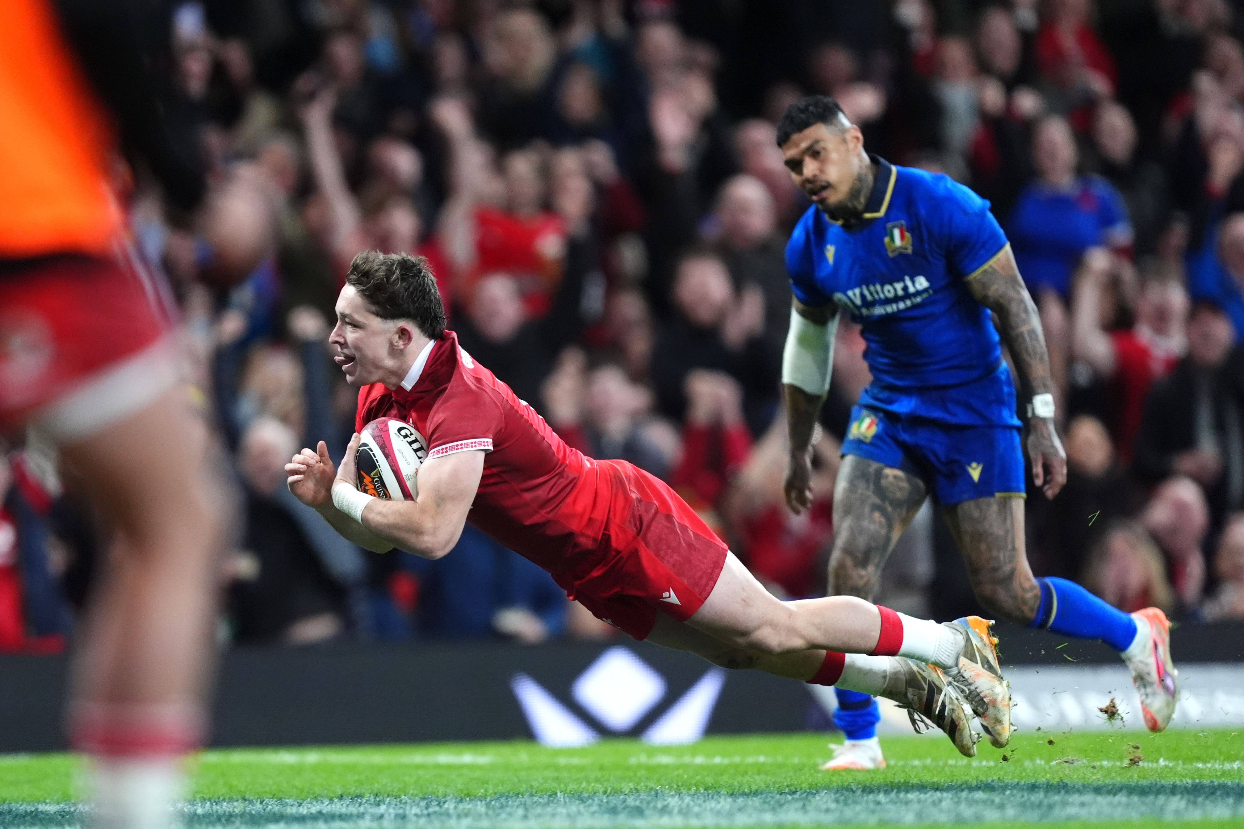 Wales outside-half Dan Edwards scores his side’s fourth try in their Six Nations victory against Italy