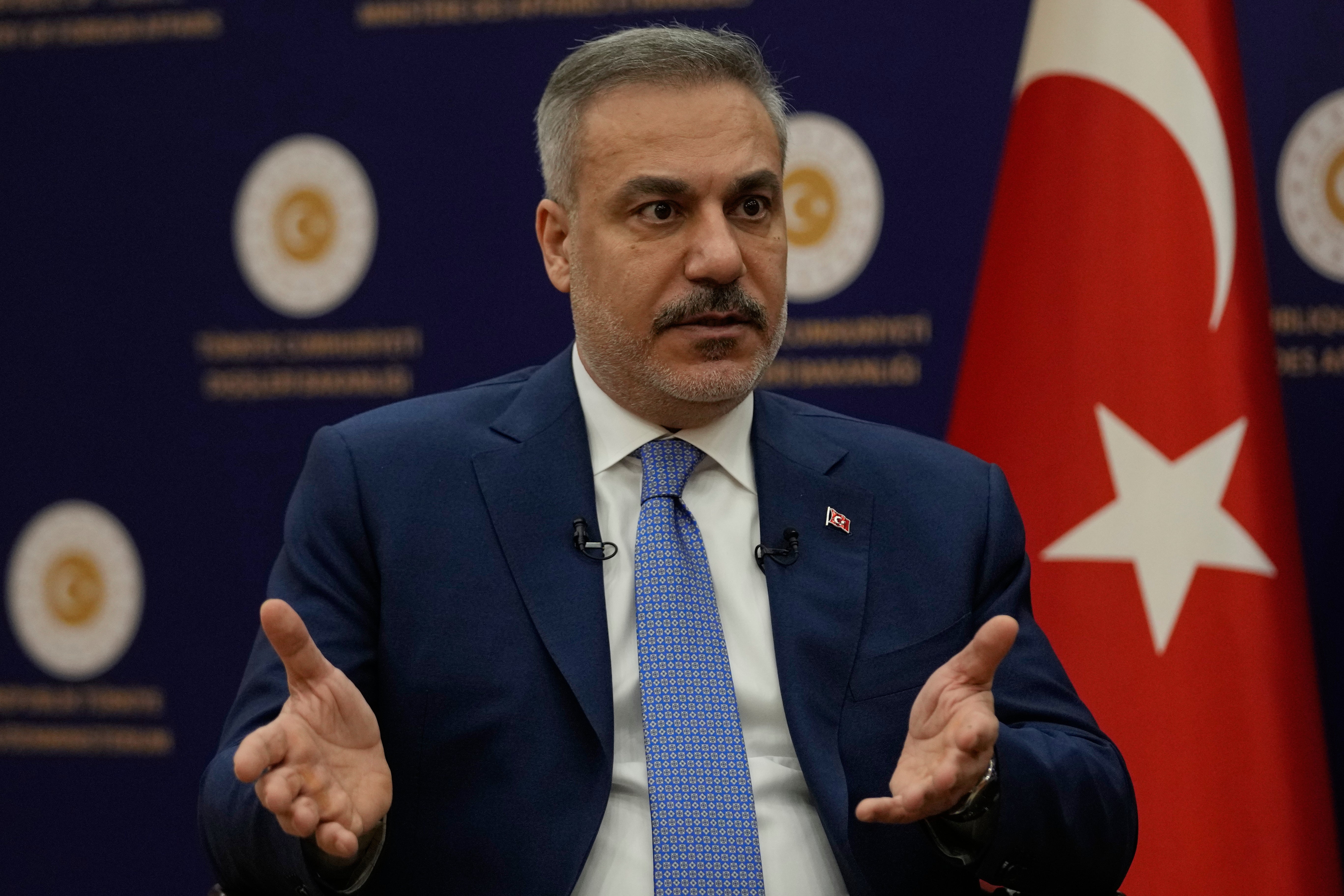 Turkey's foreign minister Hakan Fidan speaks during an interview in Ankara