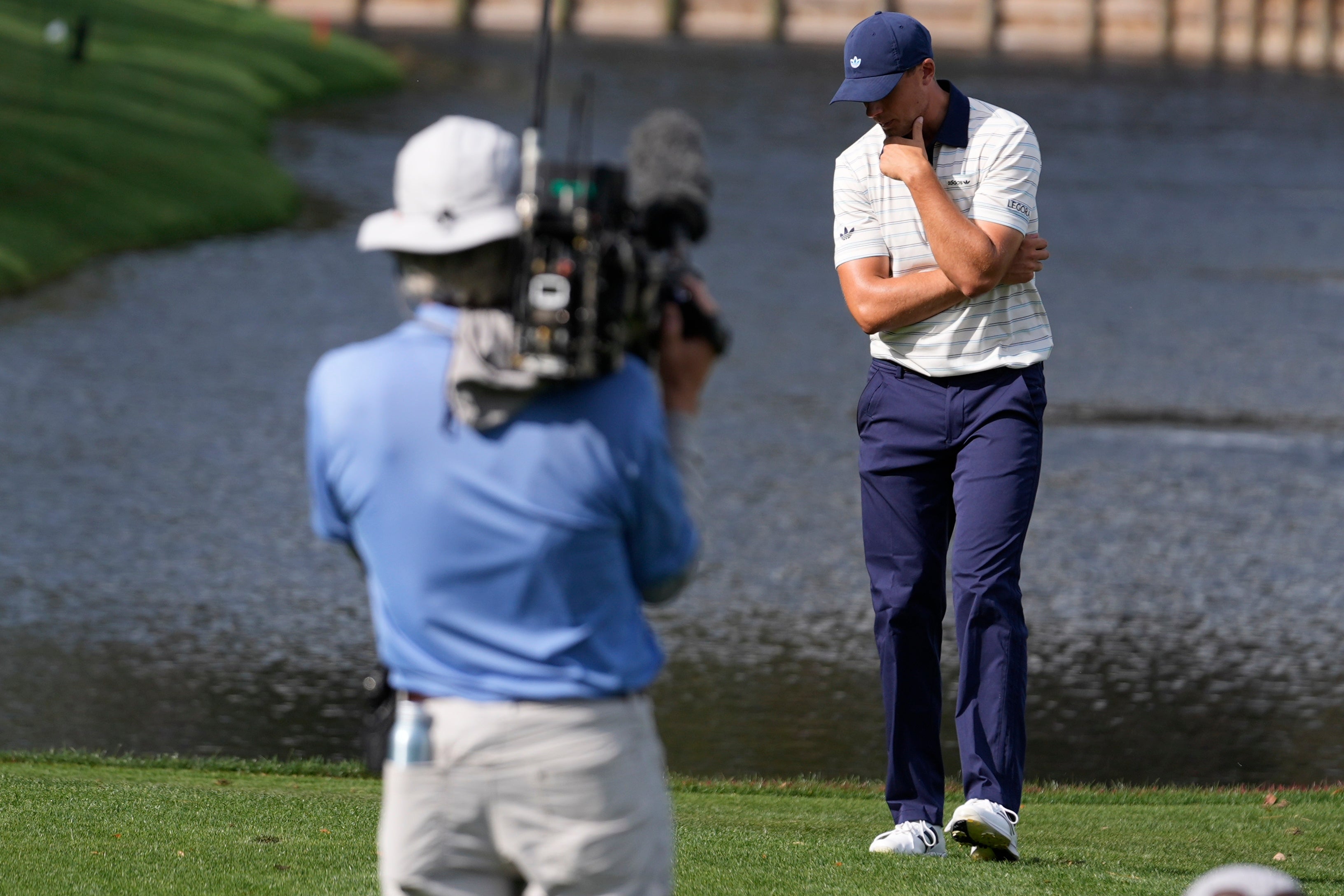Ludvig Aberg reacts to his ball hitting the water on the 12th hole