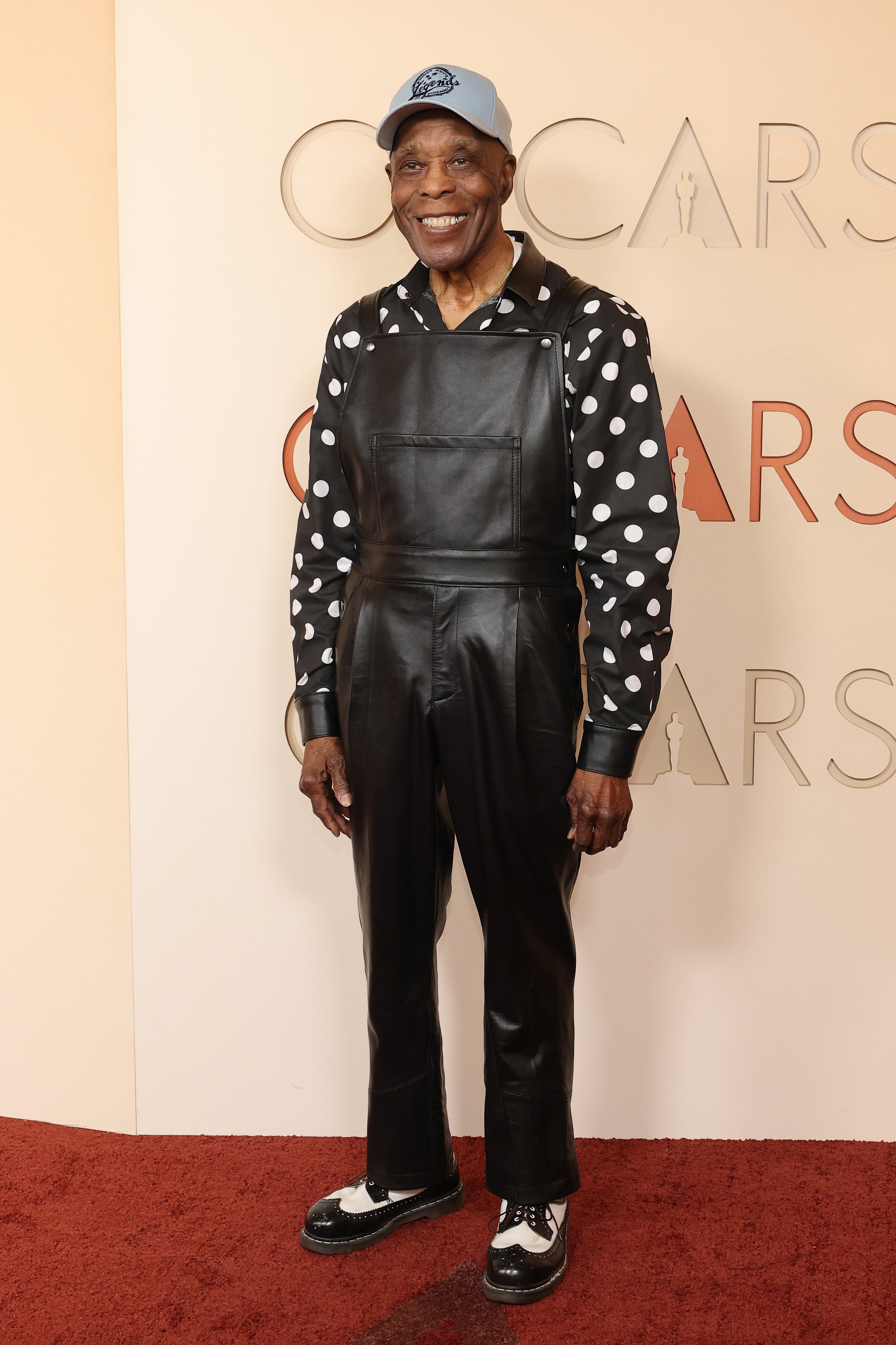 Singer Buddy Guy went a bit too quirky for the red carpet, sporting a baseball hat with leather overalls and a polka dot button-up shirt