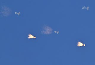 This photograph shows Ukrainian air defence firing at drones during a Russian drone and missile attack over Kyiv