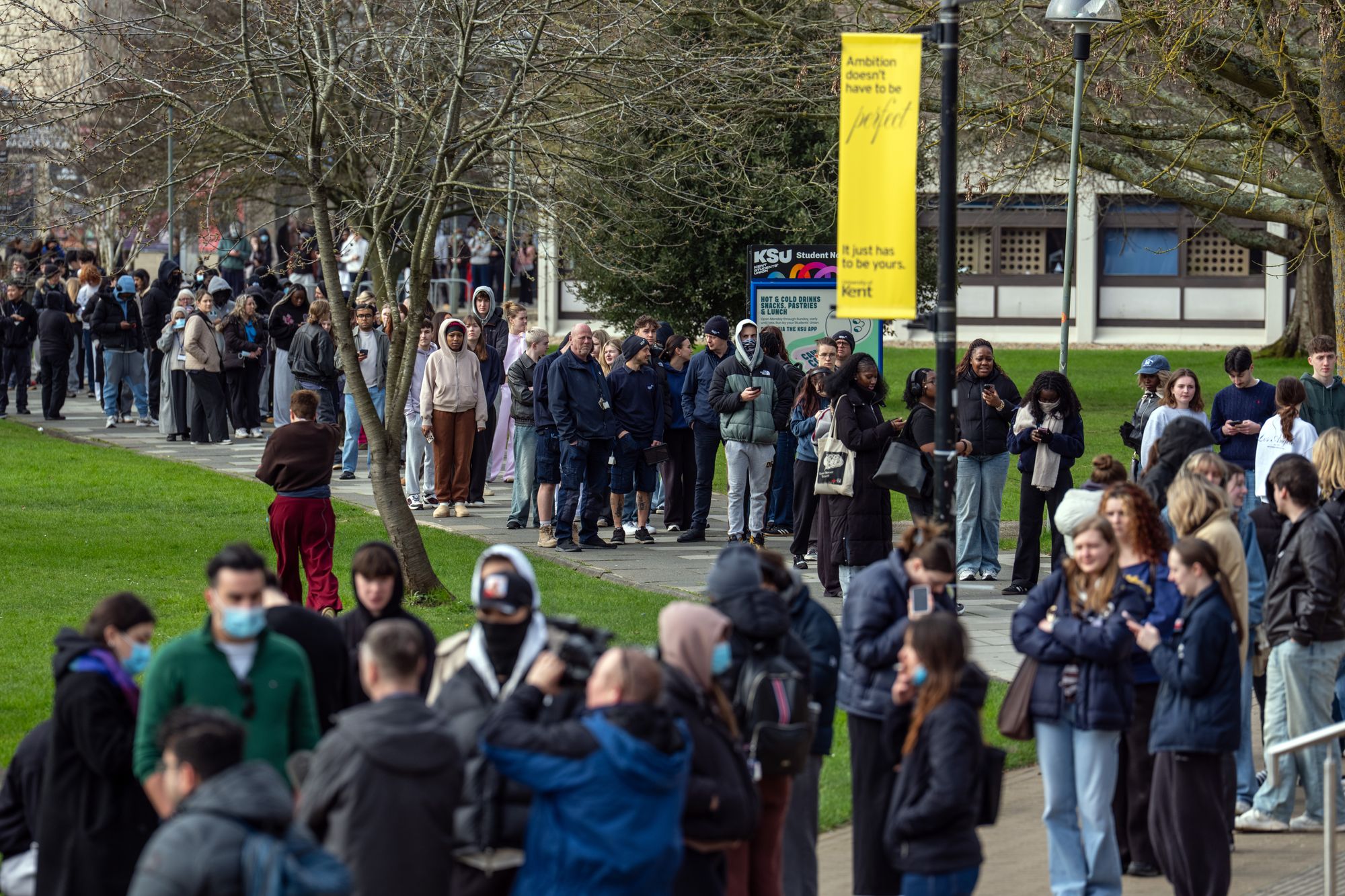 Students queuing for meningitis vaccinations