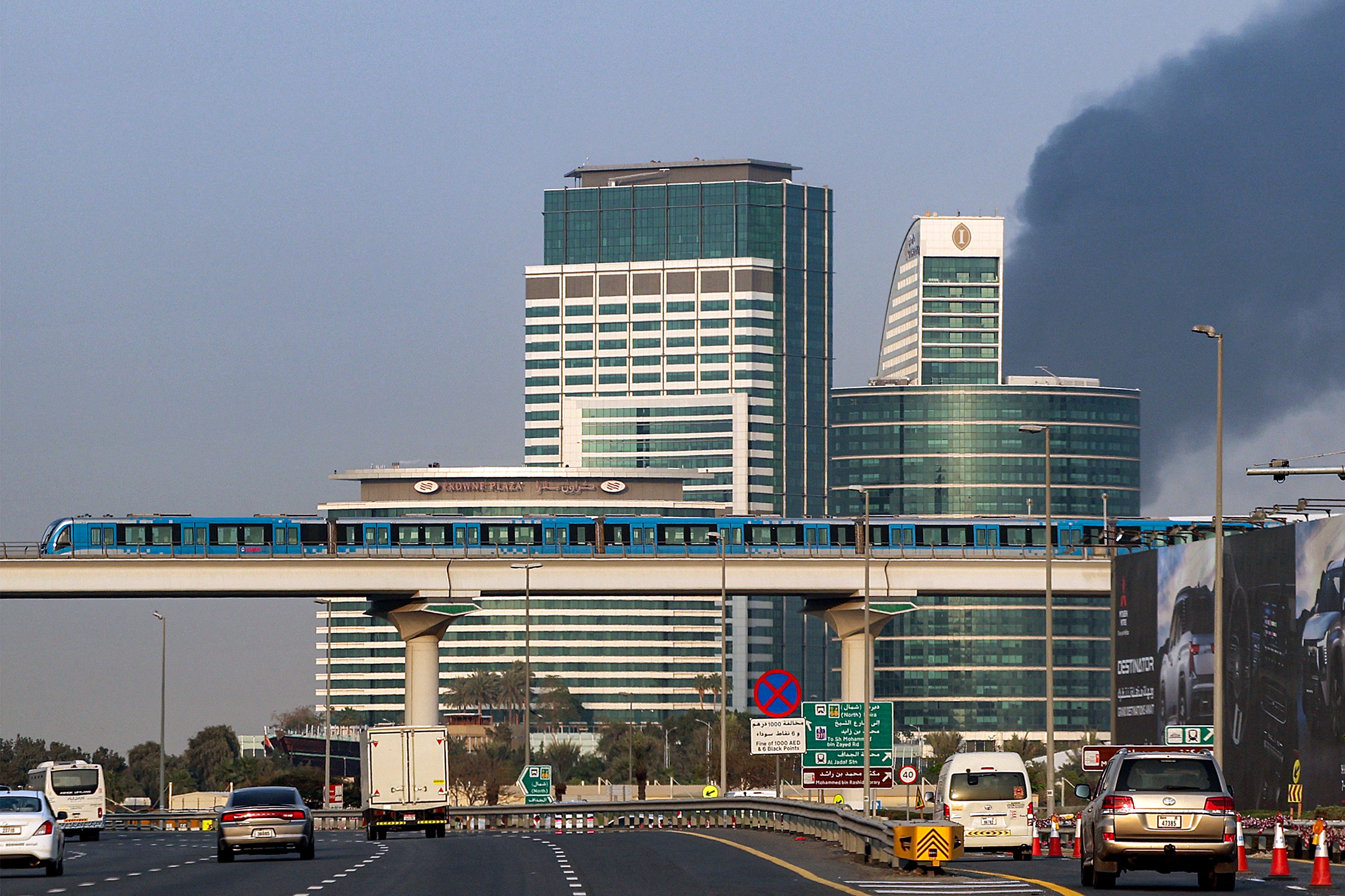 Smoke billowing into the sky from near Dubai airport (AFP/Getty)