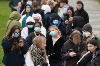 Students queuing for antibiotics outside a building at the University of Kent in Canterbury (Gareth Fuller/PA)