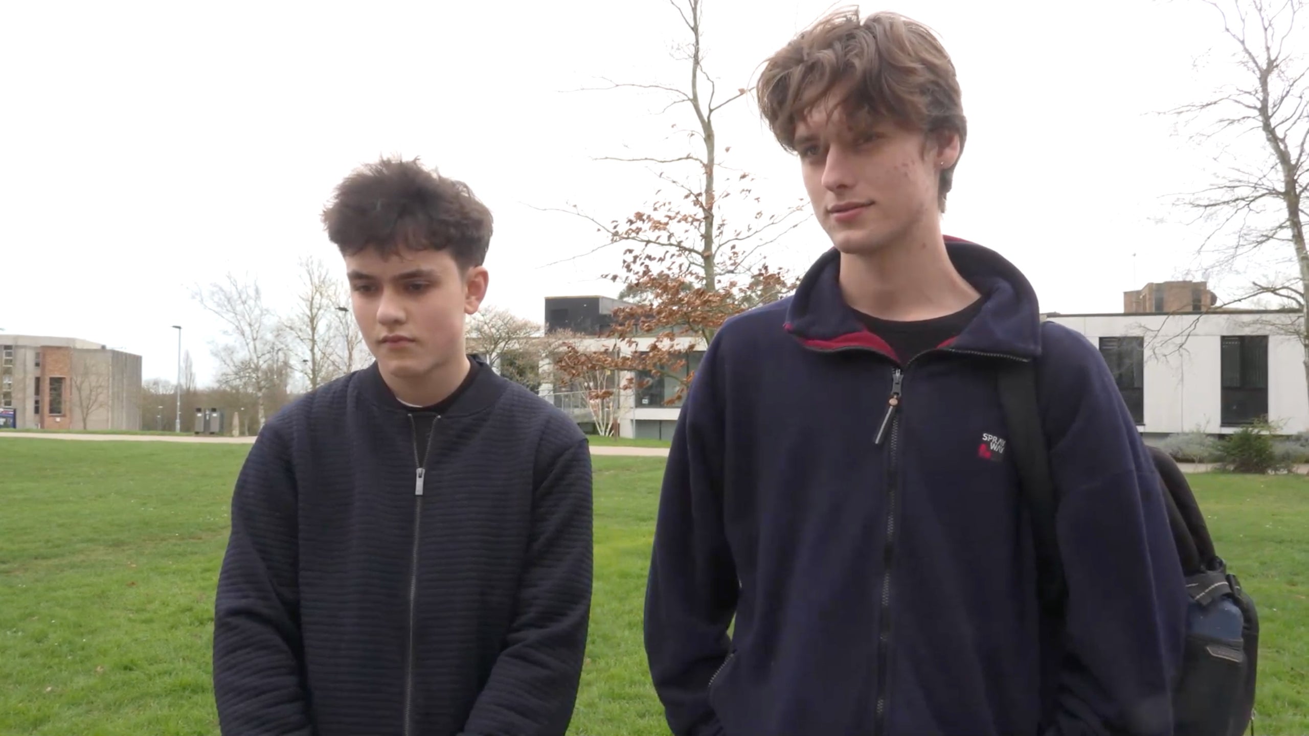 Matthew (left), 16, and Luca McDonagh, 17, in the queue for antibiotics at the University of Kent in Canterbury