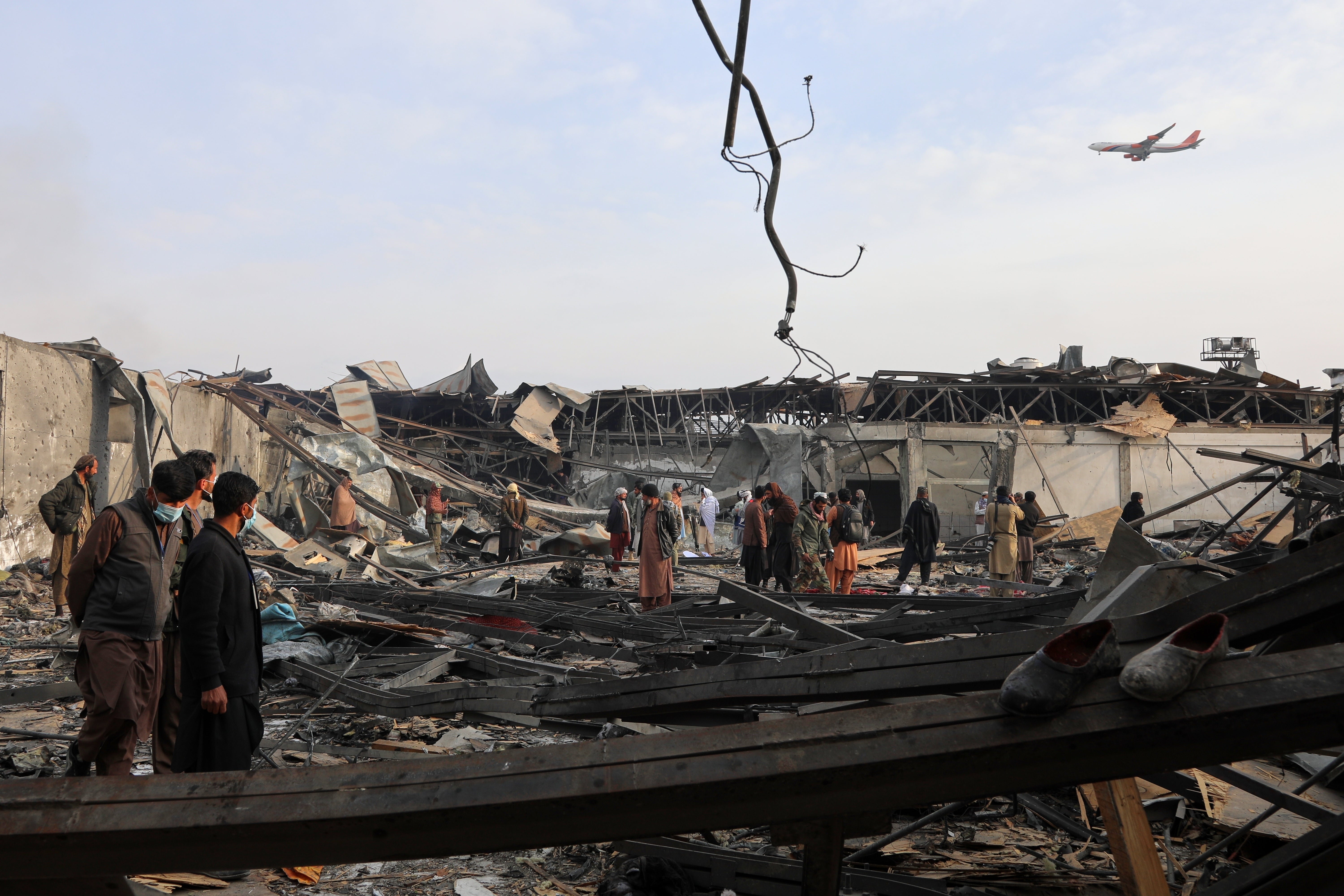 Residents and volunteers inspect the site of a late-Monday airstrike at a drug rehabilitation hospital in Kabul, Afghanistan, Tuesday, March 17, 2026. (AP Photo/Siddiqullah Alizai)