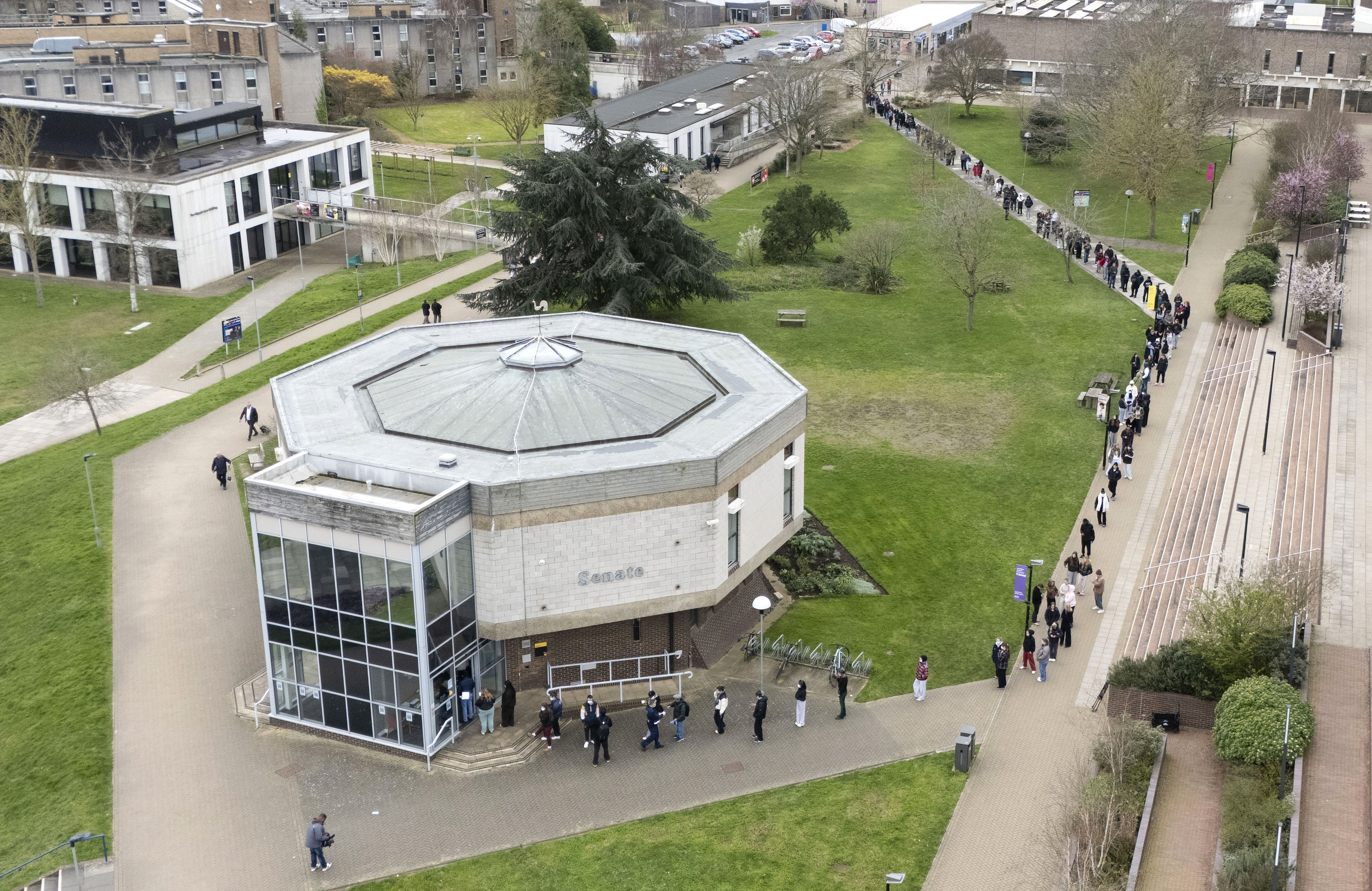 Students queuing for antibiotics at the University of Kent on Monday