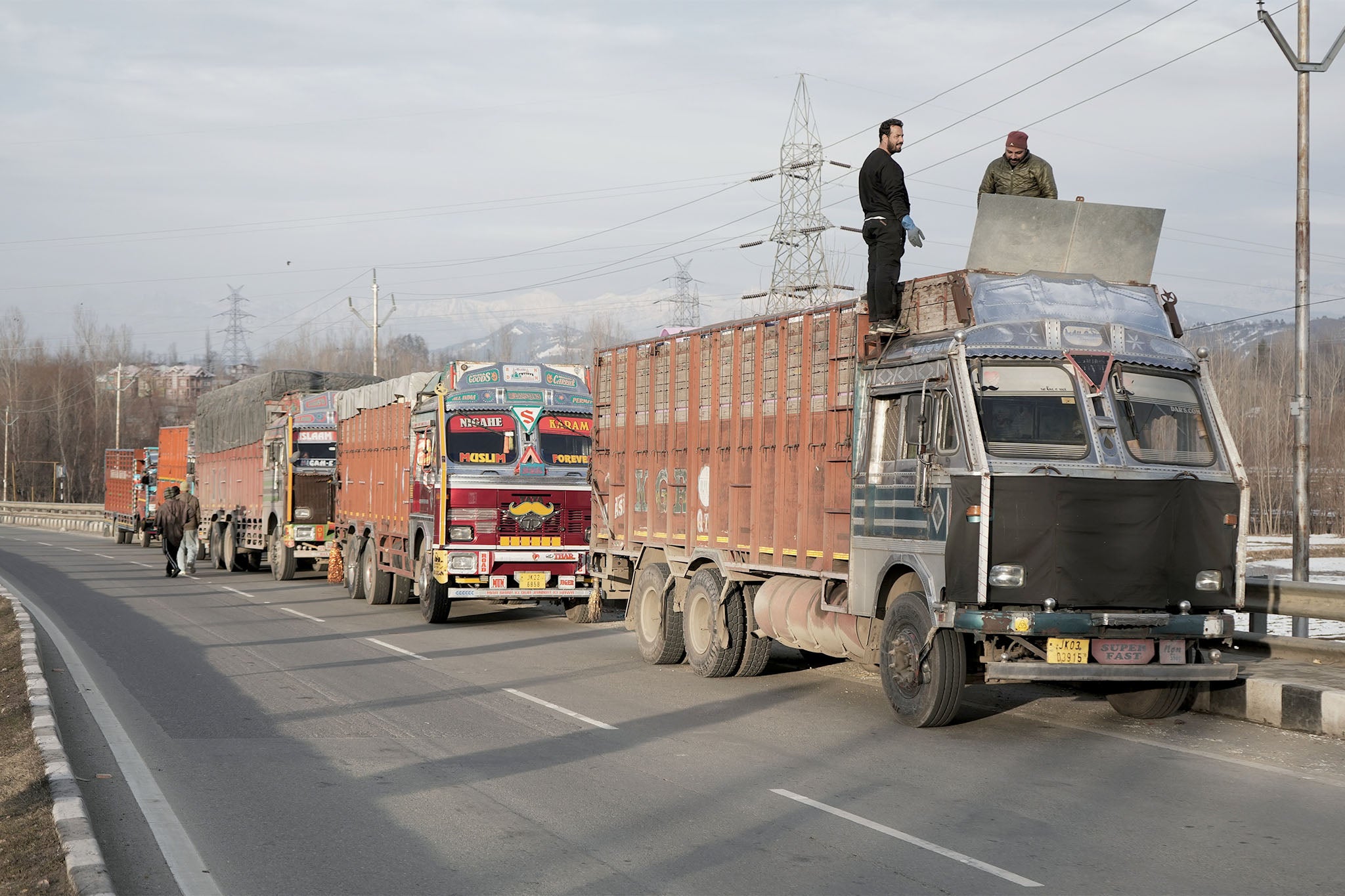 Trucks halted at Qazigund following the traffic regulations on Jammu-Srinagar National Highway