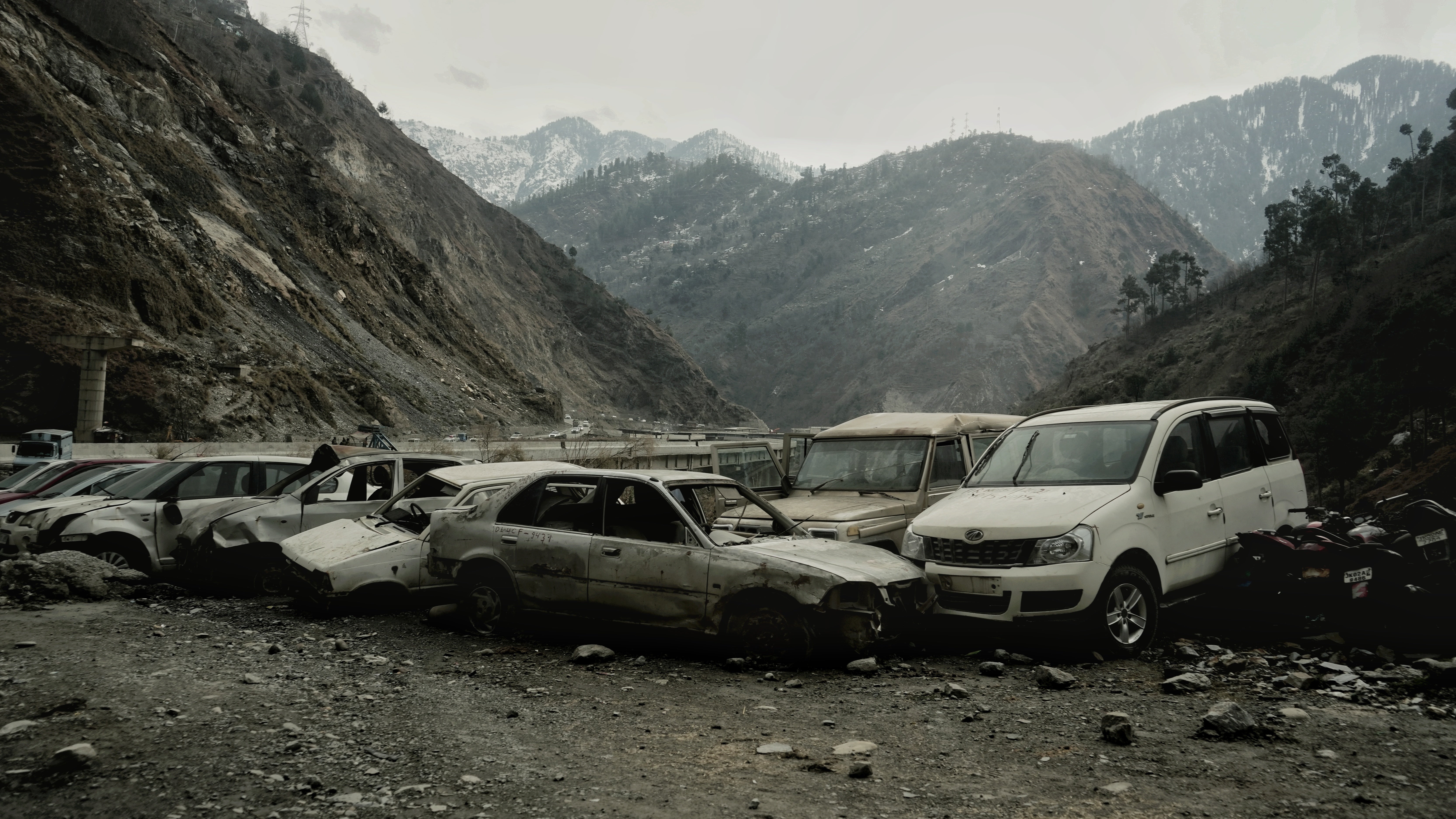 Wreckage of vehicles damaged in different accidents on the Jammu-Srinagar National Highway near Ramsoo Police Station