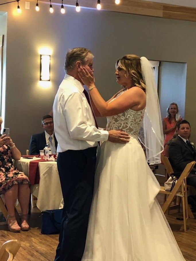 Tara Hastings and her father Steve dance at her wedding in August 2020. She met her husband Brent after she moved back to Indiana to be closer to her father. Since then, Steve has declined with Alzheimer’s disease and can no longer walk
