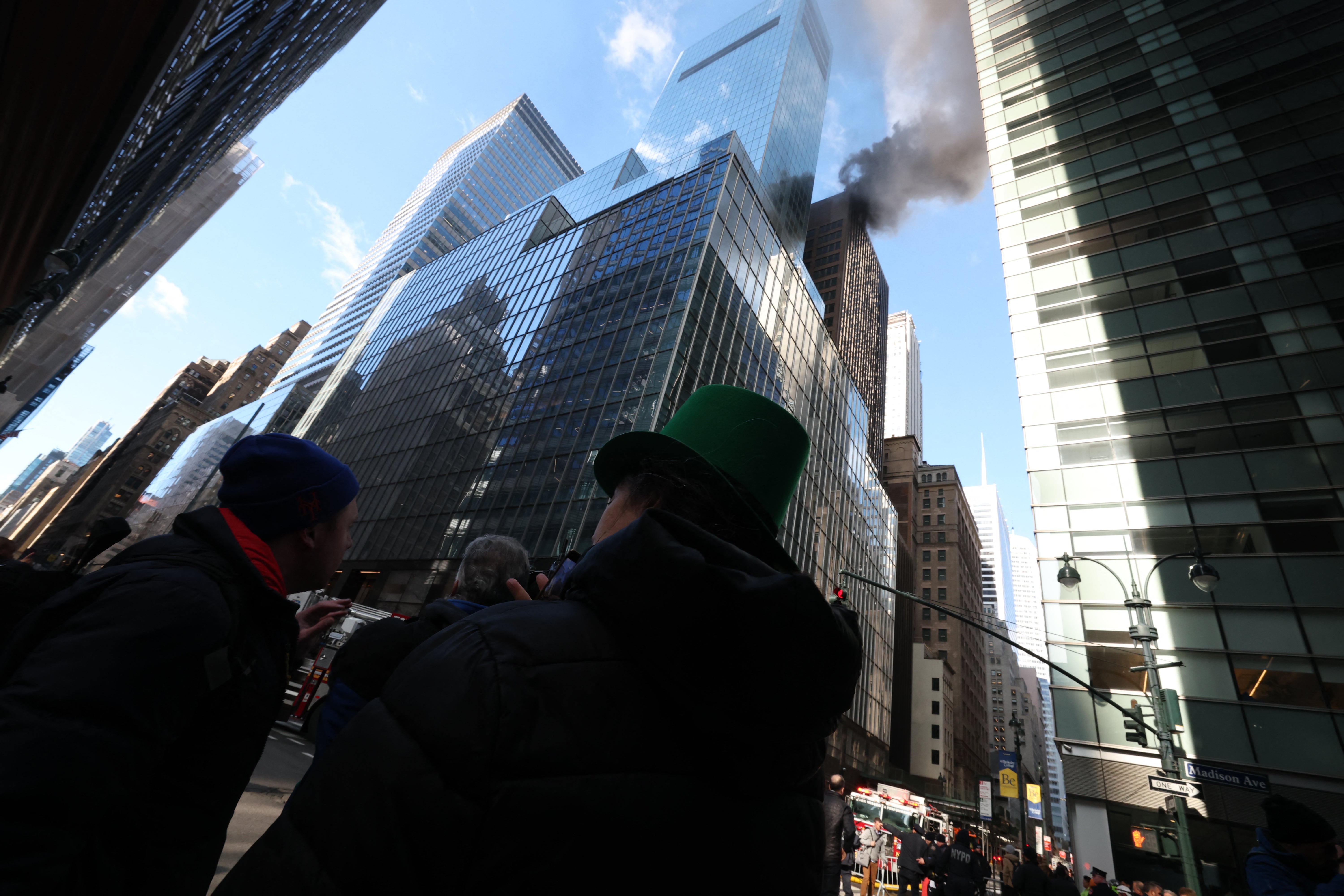 Video shared online showed a tall plume of black smoke coming from the roof of a building at 6 East 43rd Street between Fifth Avenue and Madison Avenue