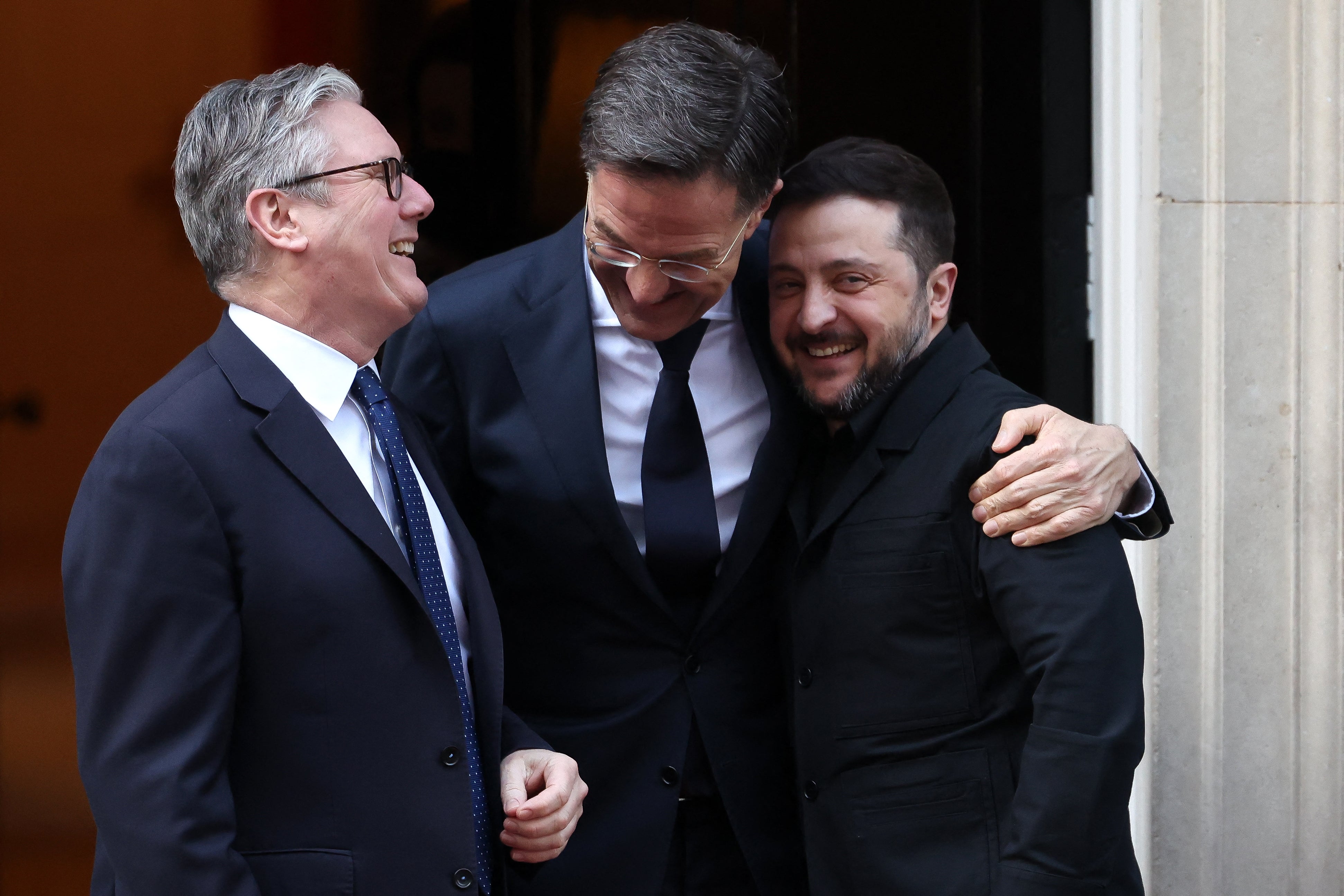 Prime minister Keir Starmer, Nato secretary general Mark Rutte and Ukraine's president Volodymyr Zelensky react following a meeting at 10 Downing Street