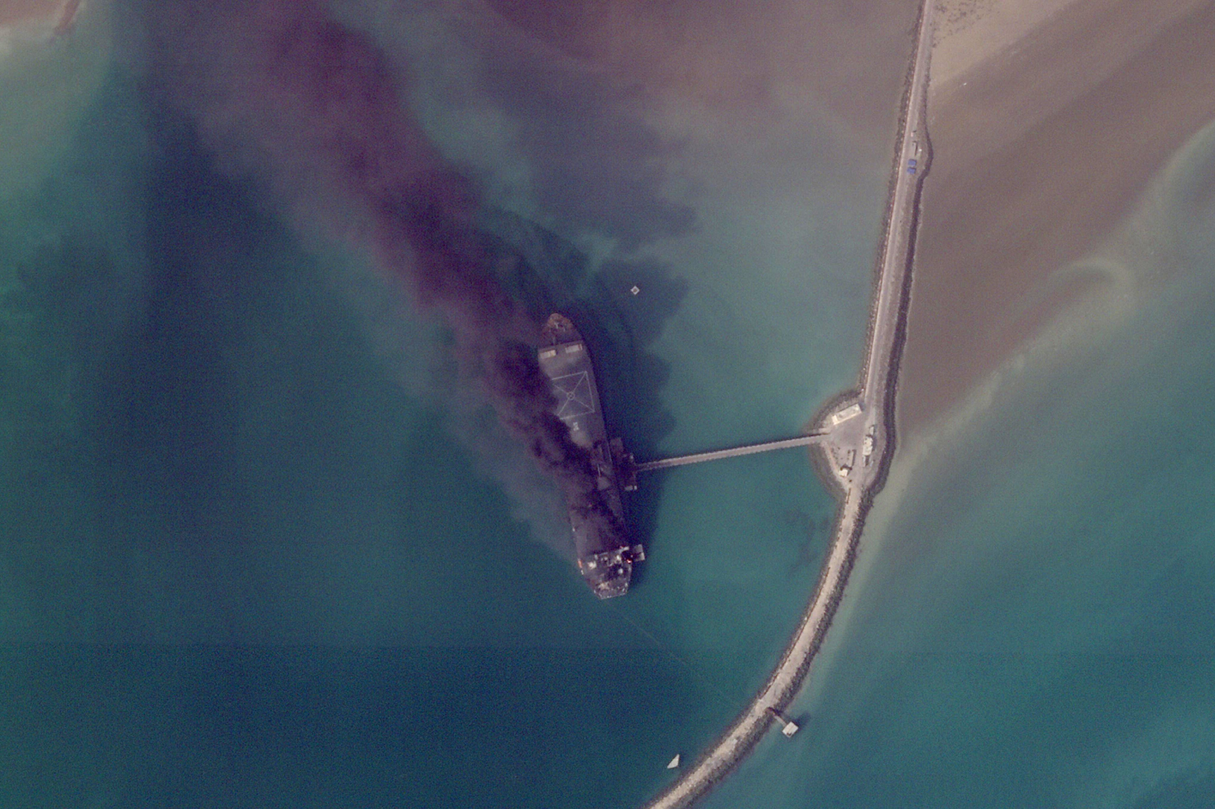 A satellite image from Planet Labs PBC shows fires burning on a ship after a U.S. military attack on a port in Bandar Abbas, Iran, March 2, 2026