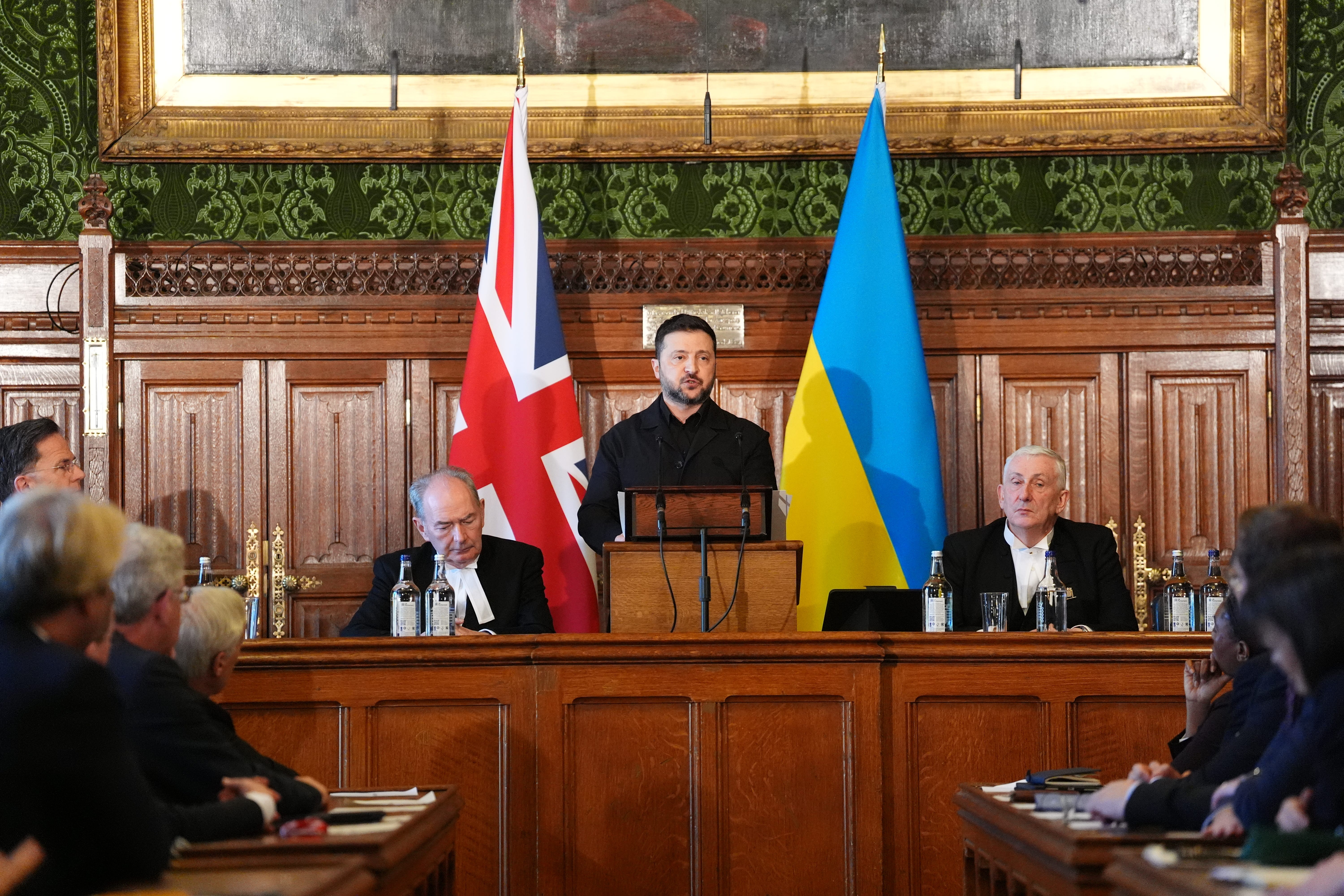 Ukrainian president Volodymyr Zelensky delivers a speech to Members of Parliament in Committee Room 14 at the House of Commons in central London