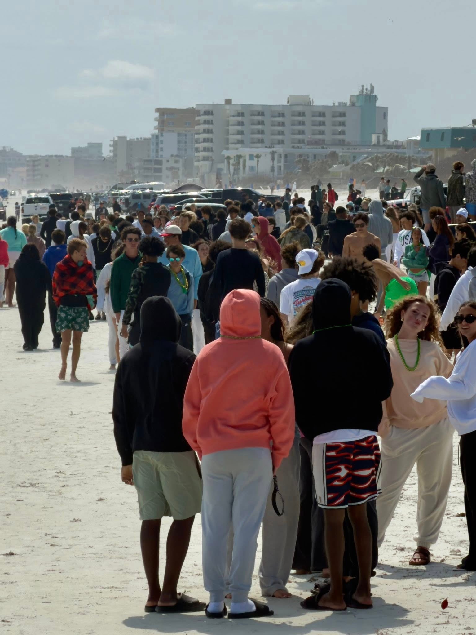 Crowds gather on New Smyrna Beach for spring break celebrations