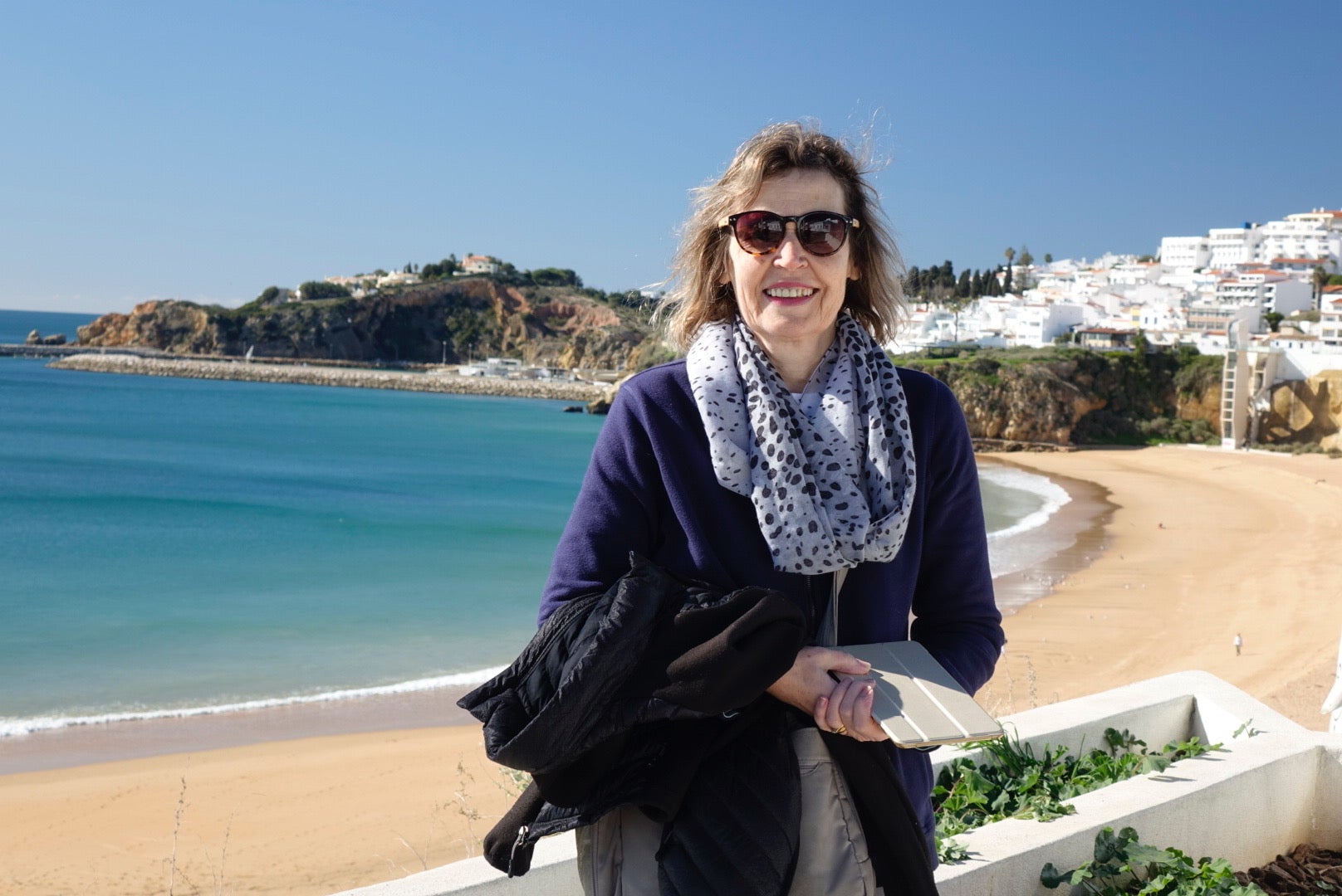 Tina relaxes on the beach on one of her trips