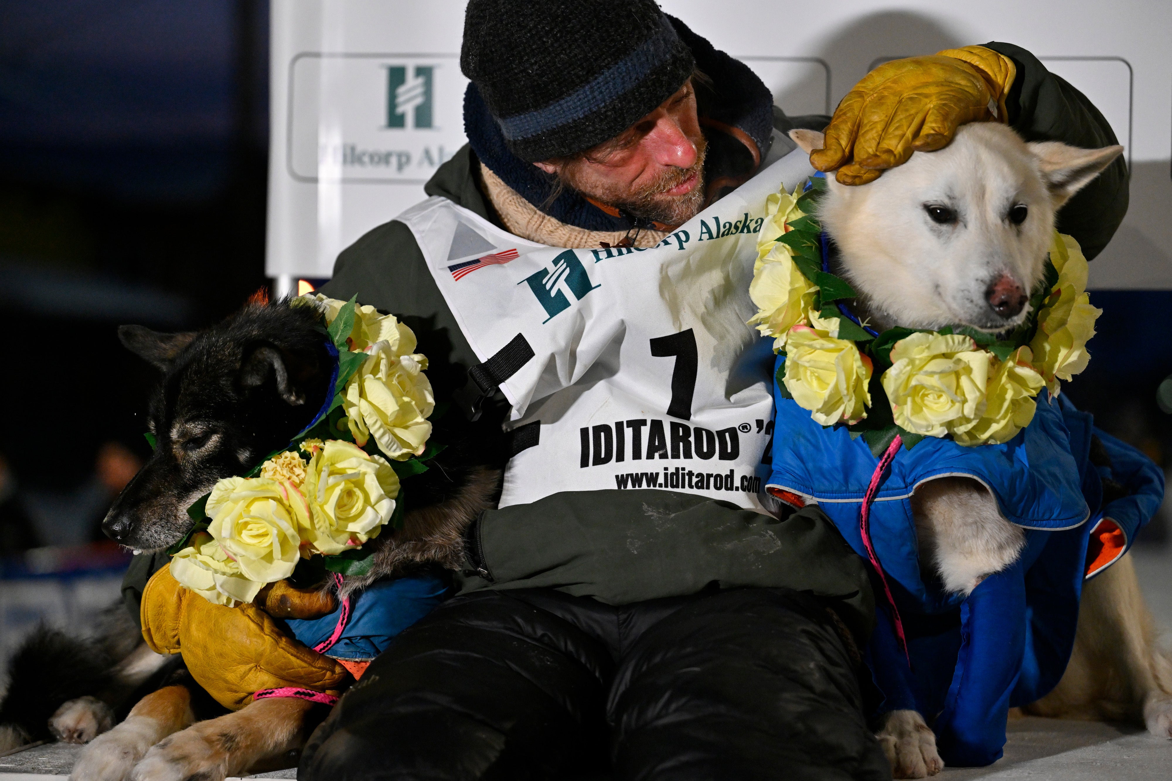 Holmes celebrates with his dogs