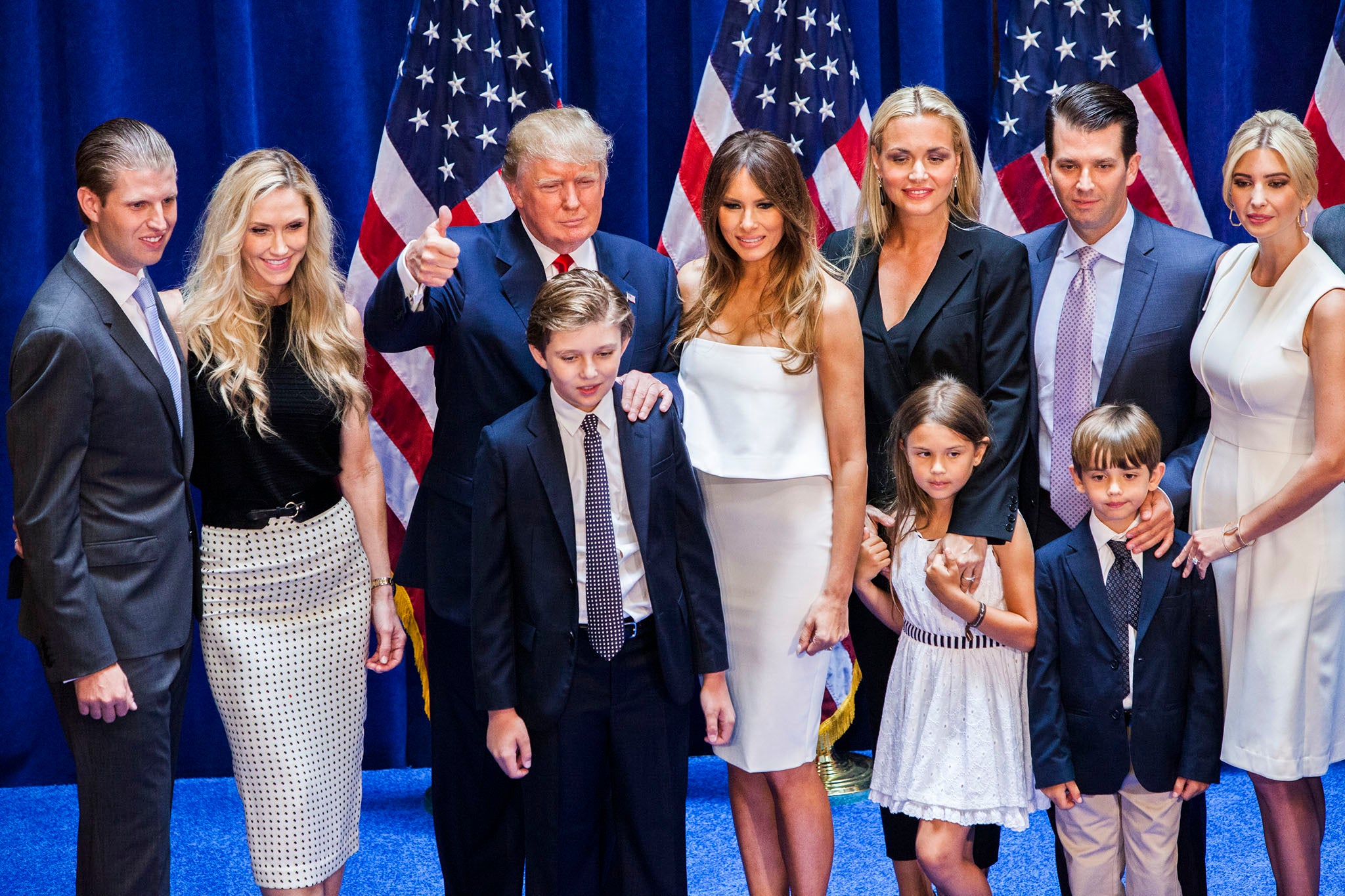 (L-R) Eric Trump, Lara Yunaska Trump, Donald Trump, Barron Trump, Melania Trump, Vanessa Haydon Trump, Kai Madison Trump, Donald Trump Jr., Donald John Trump III, and Ivanka Trump pose for photos on stage after Donald Trump announced his candidacy for the U.S. presidency at Trump Tower on June 16, 2015 in New York City