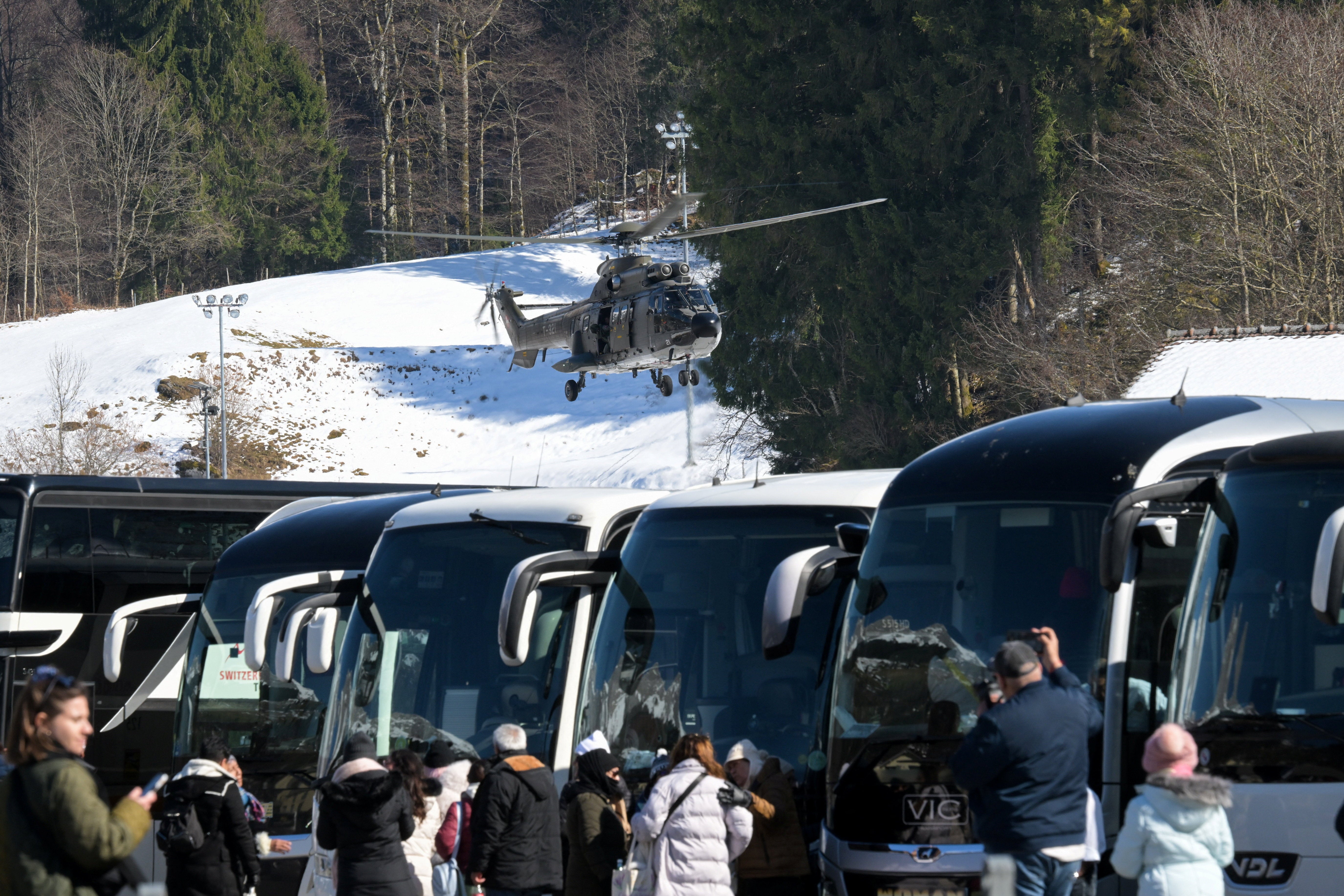 A military helicopter lands near Titlis cable car station after a gondola crashed in Engelberg