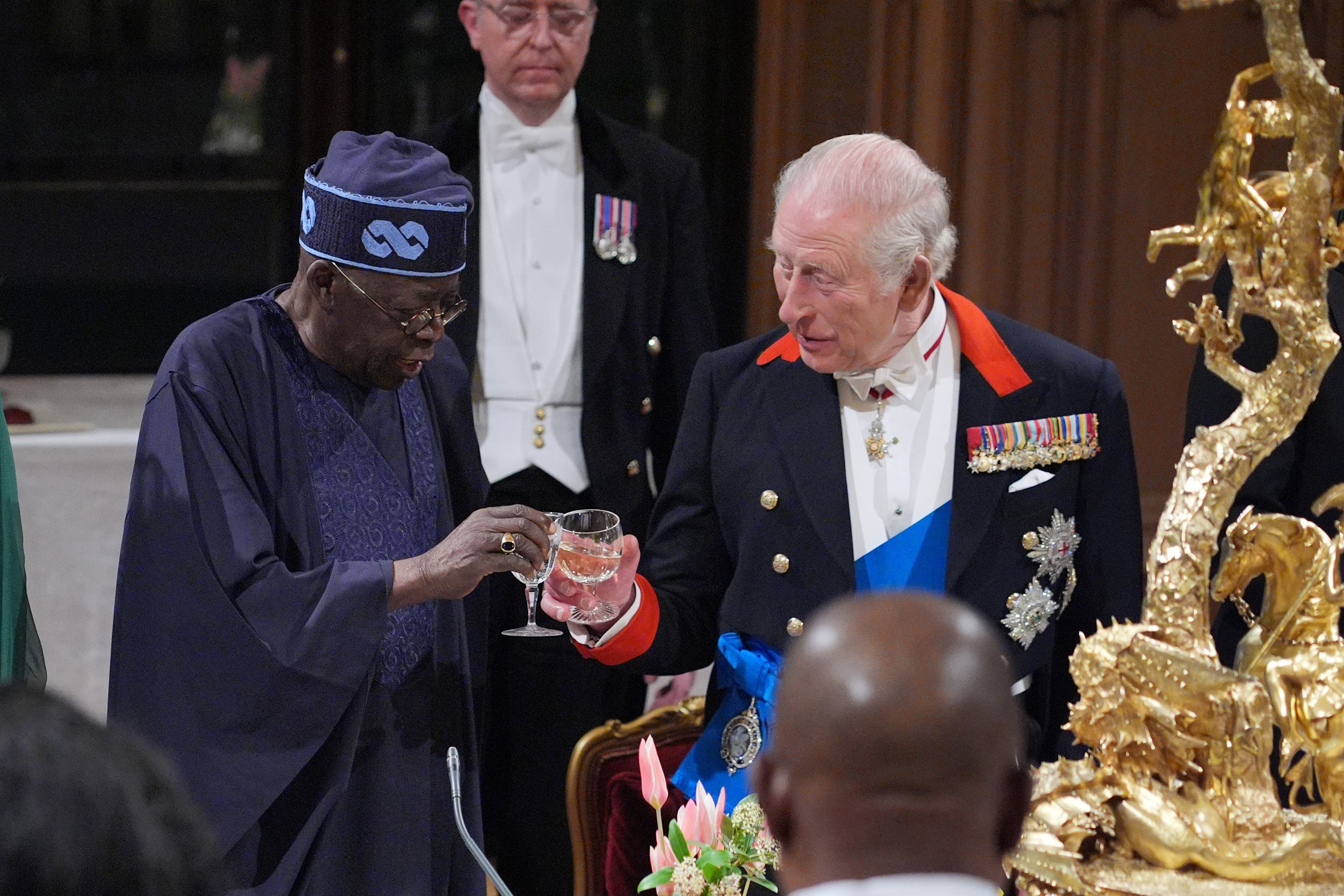 President of Nigeria Bola Ahmed Tinubu and King Charles during the state banquet (Yui Mok/PA)