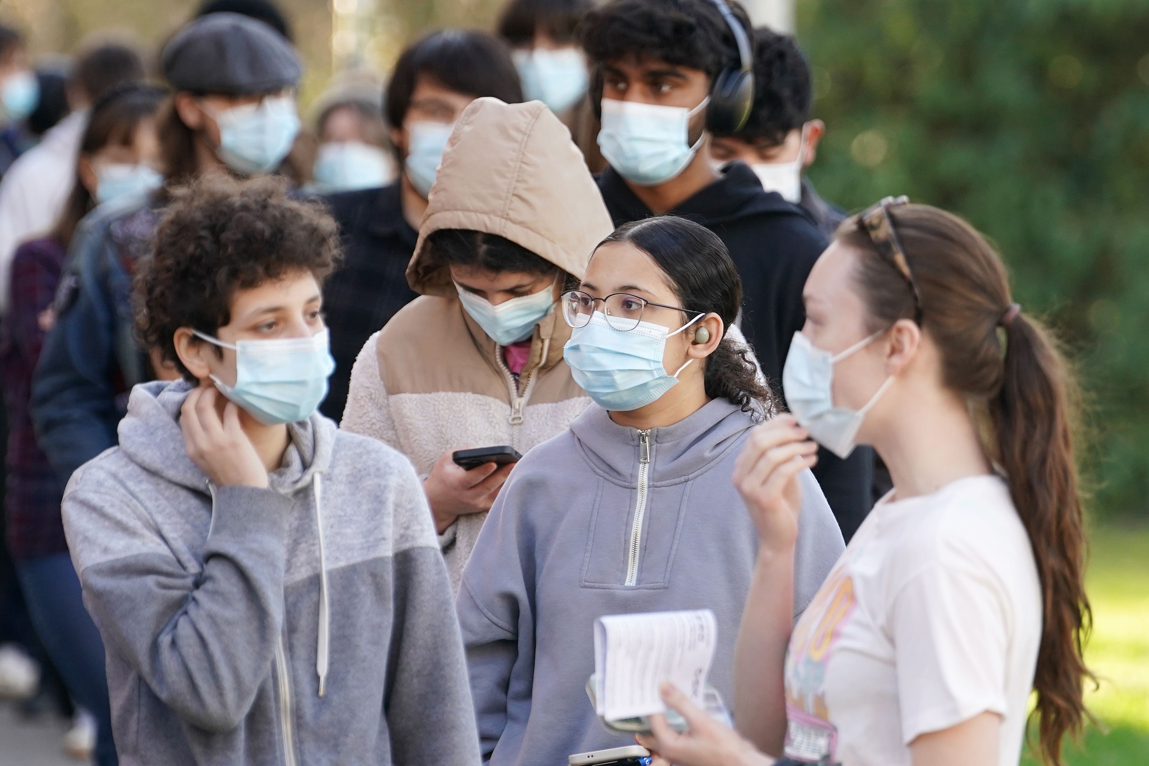 Students wait in line at the entrance to the sports hall at the University of Kent campus in Canterbury, where the rollout of a meningitis B vaccine has begun (Gareth Fuller/PA)