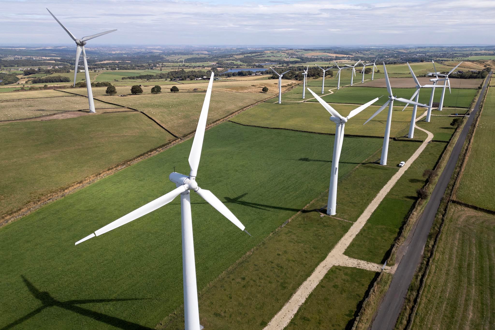 Wind farms, solar power, and installing heat pumps in homes are ways to reduce our dependence on fossil fuels.