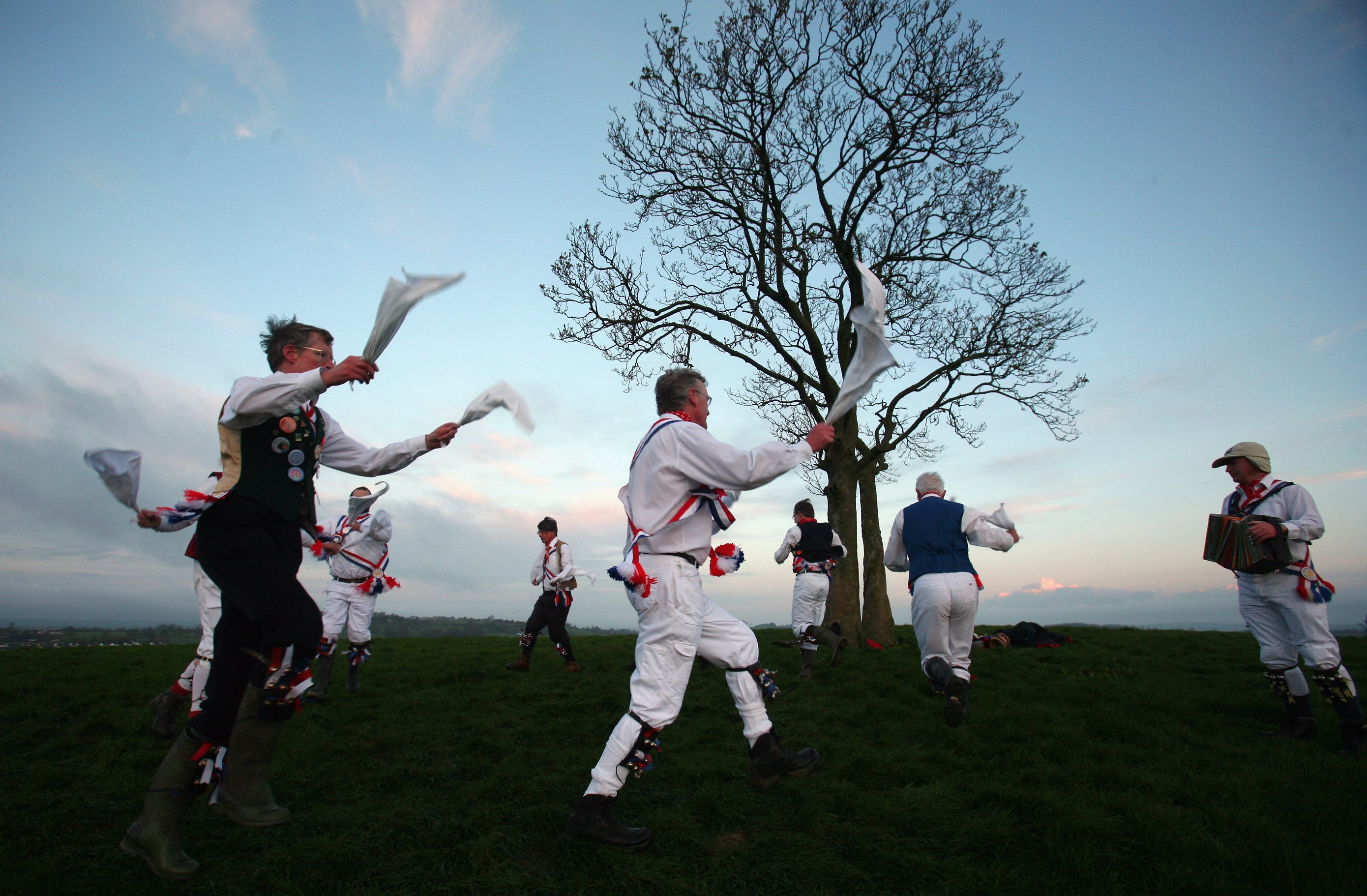 Priston Jubilee Morrismen dance at dawn at One Tree Hill on May 1 2008 in Farmborough, Somerset, England.