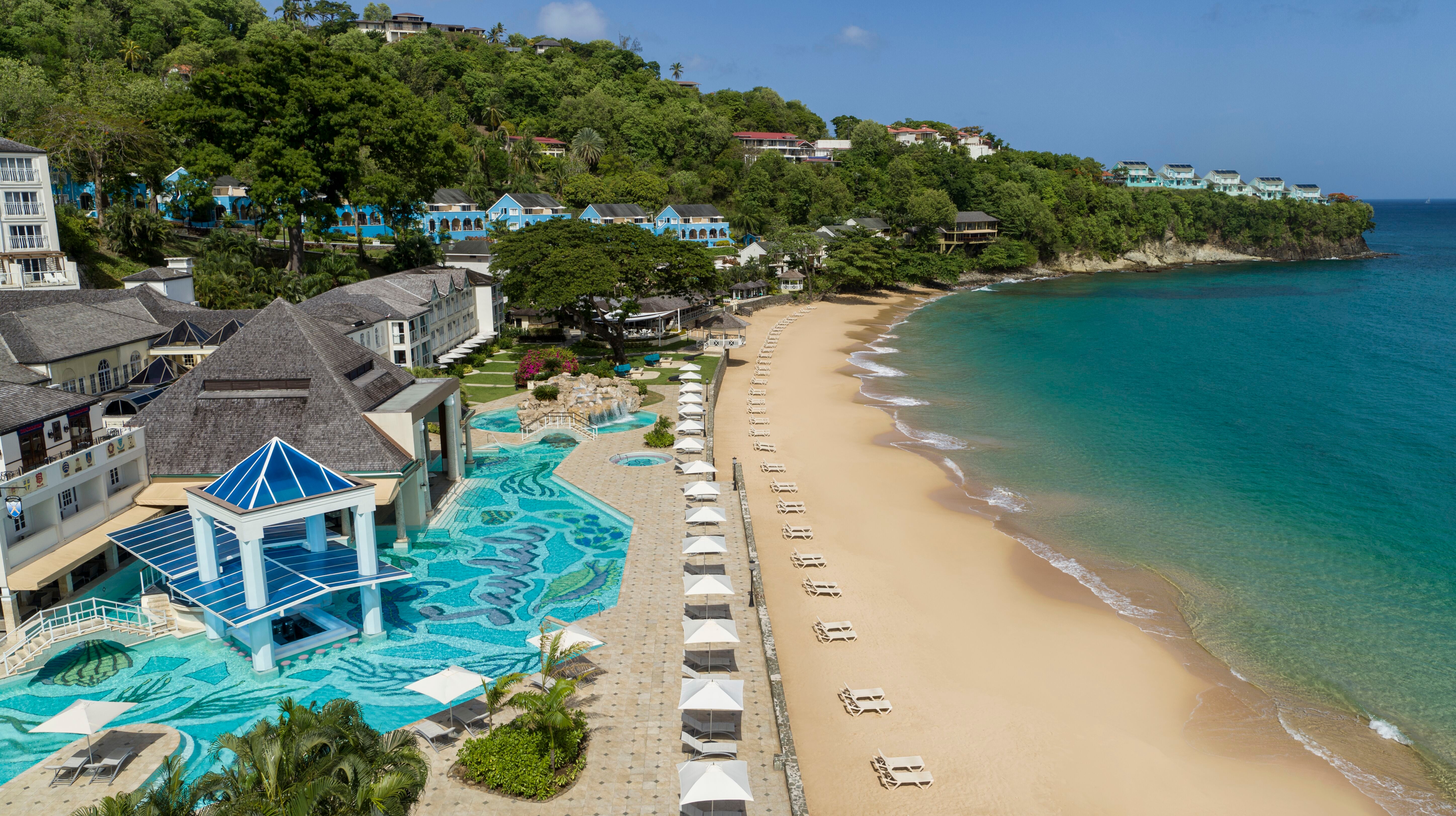 Regency La Toc hugs a white sand, crescent-shaped beach