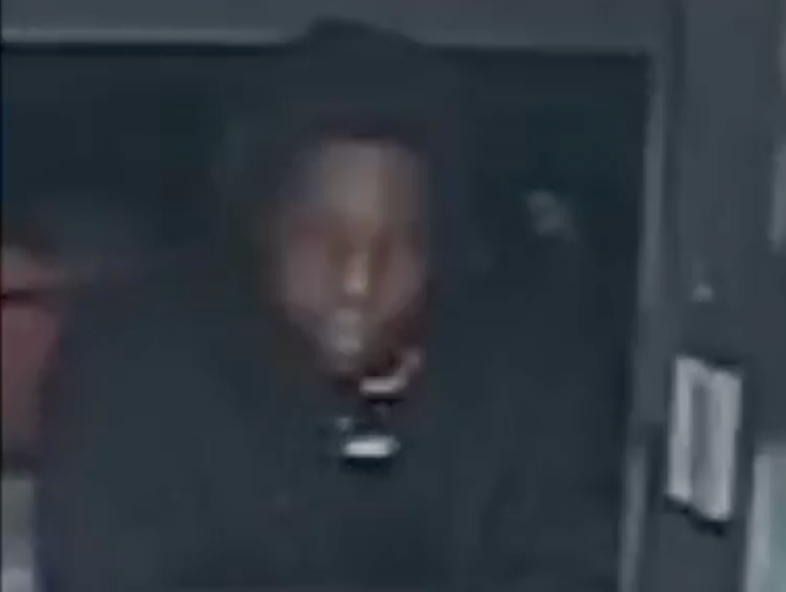 The suspect wore a black hoodie during the robbery and appeared to be leaning through one of the restaurant's windows