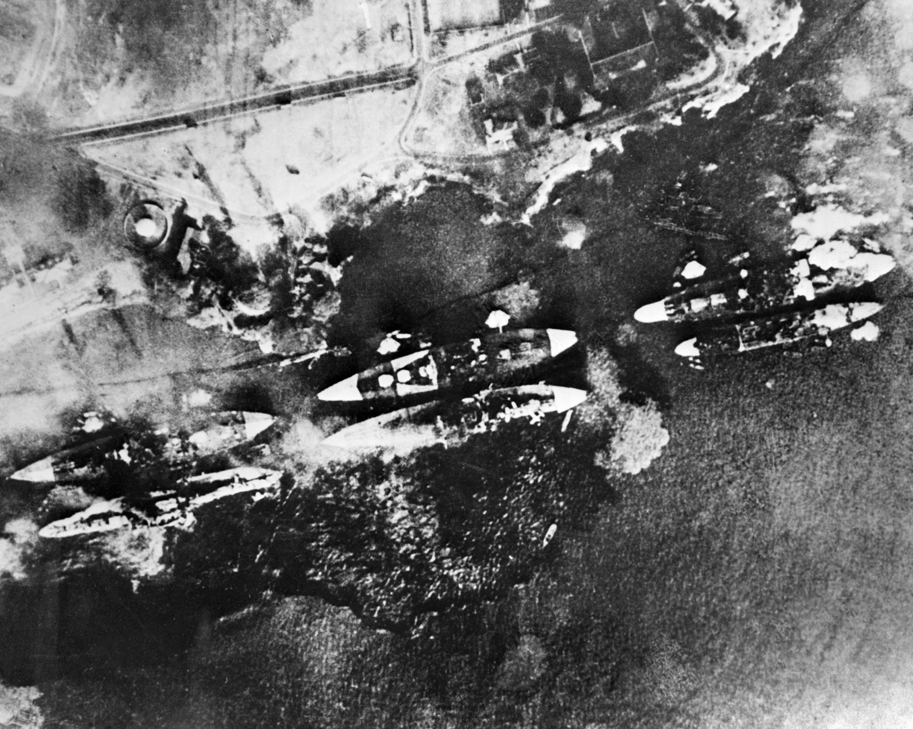 Aerial view showing the US Pacific Fleet consumed by flames in its home base at Pearl Harbor after 360 Japanese warplanes made a massive surprise attack in 1941 (AFP/Getty)