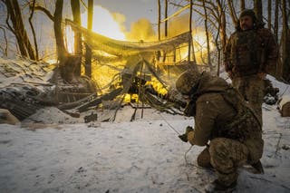 Ukrainian soldiers fire at Russian positions on the front line in the Kharkiv region of Ukraine