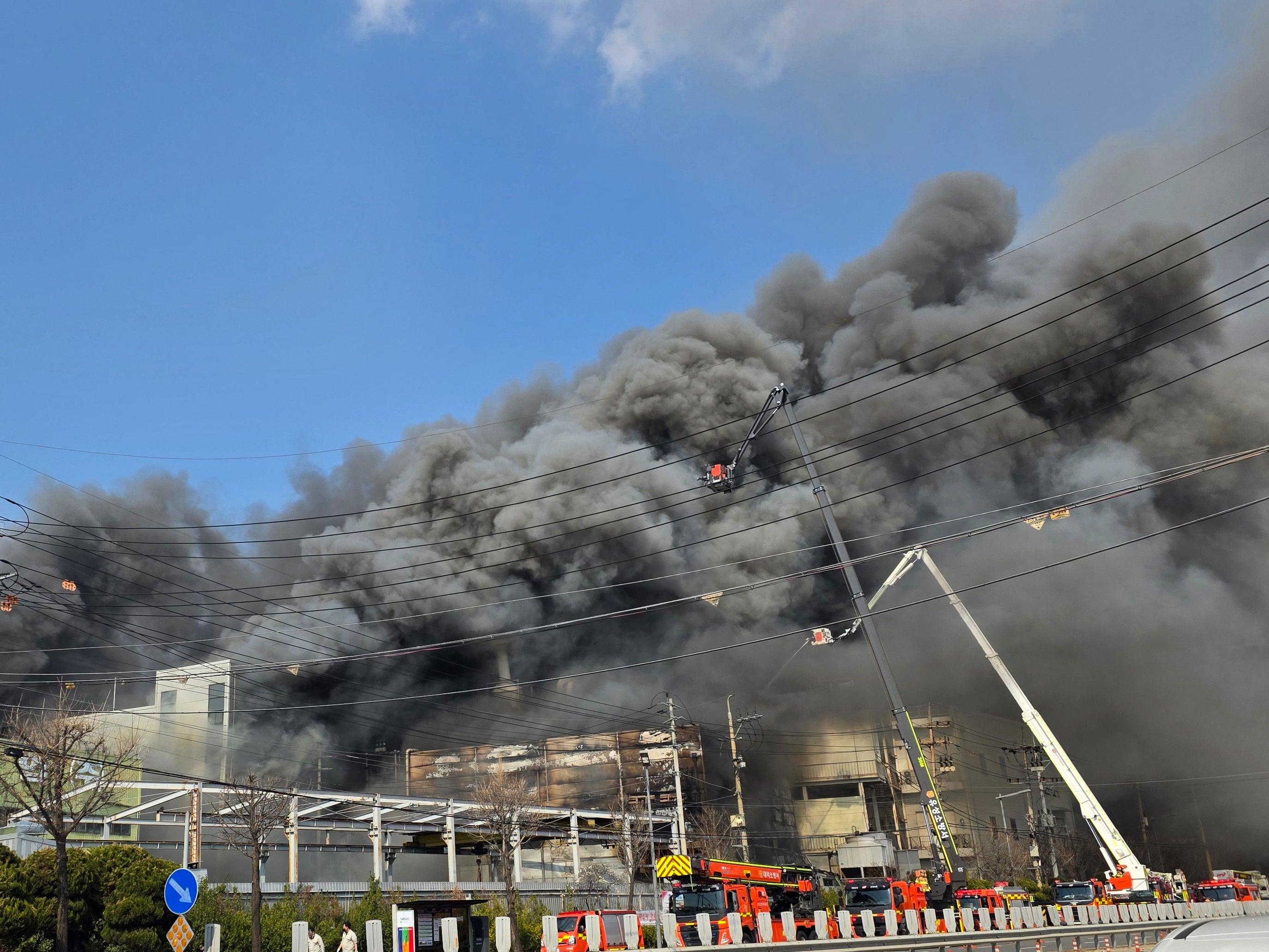 Black smoke rises from an auto parts plant in Daejeon, South Korea