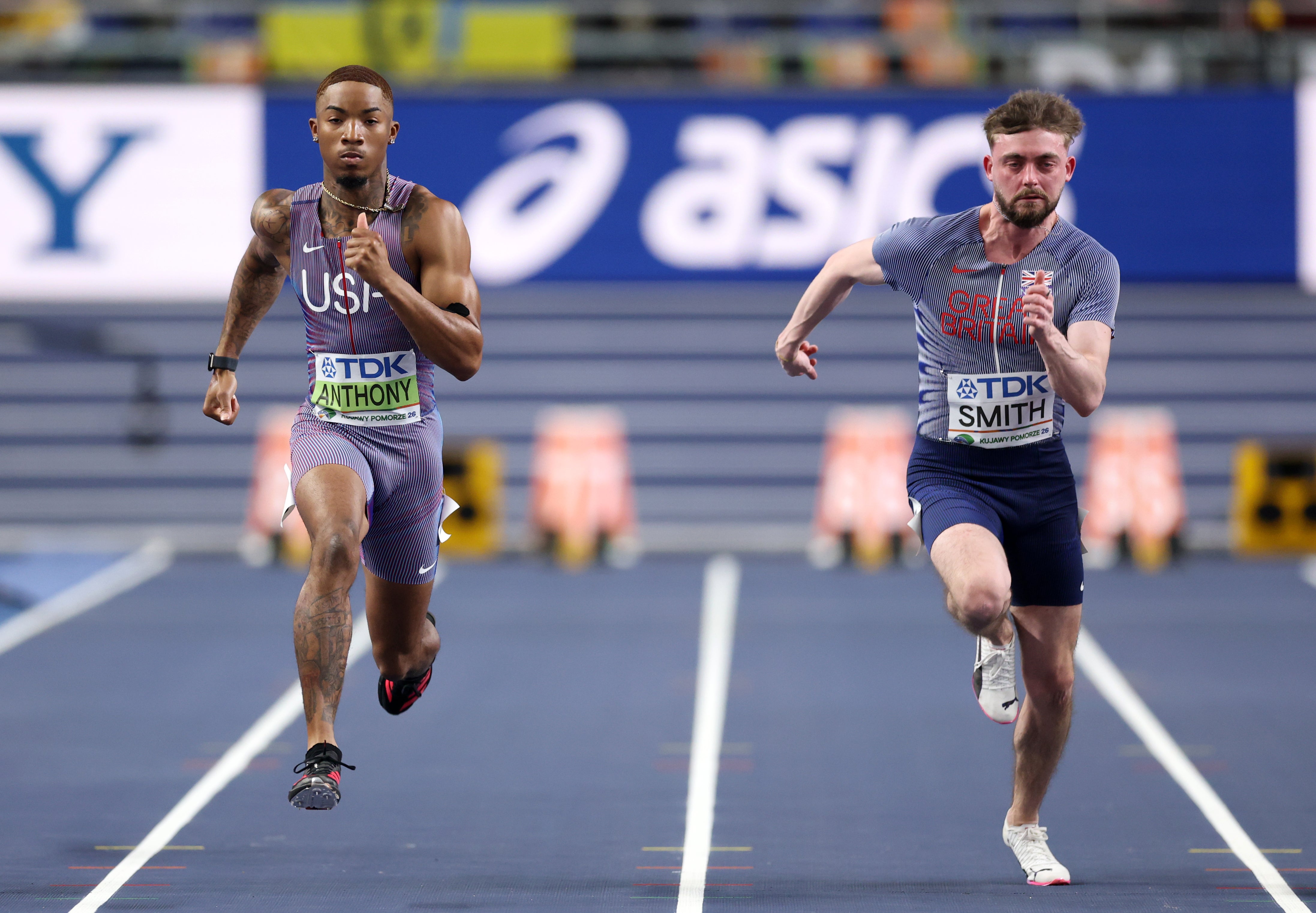 Jordan Anthony of Team United States and Jody Smith of Team Great Britain compete in the Men's 60 Metres Round One heats