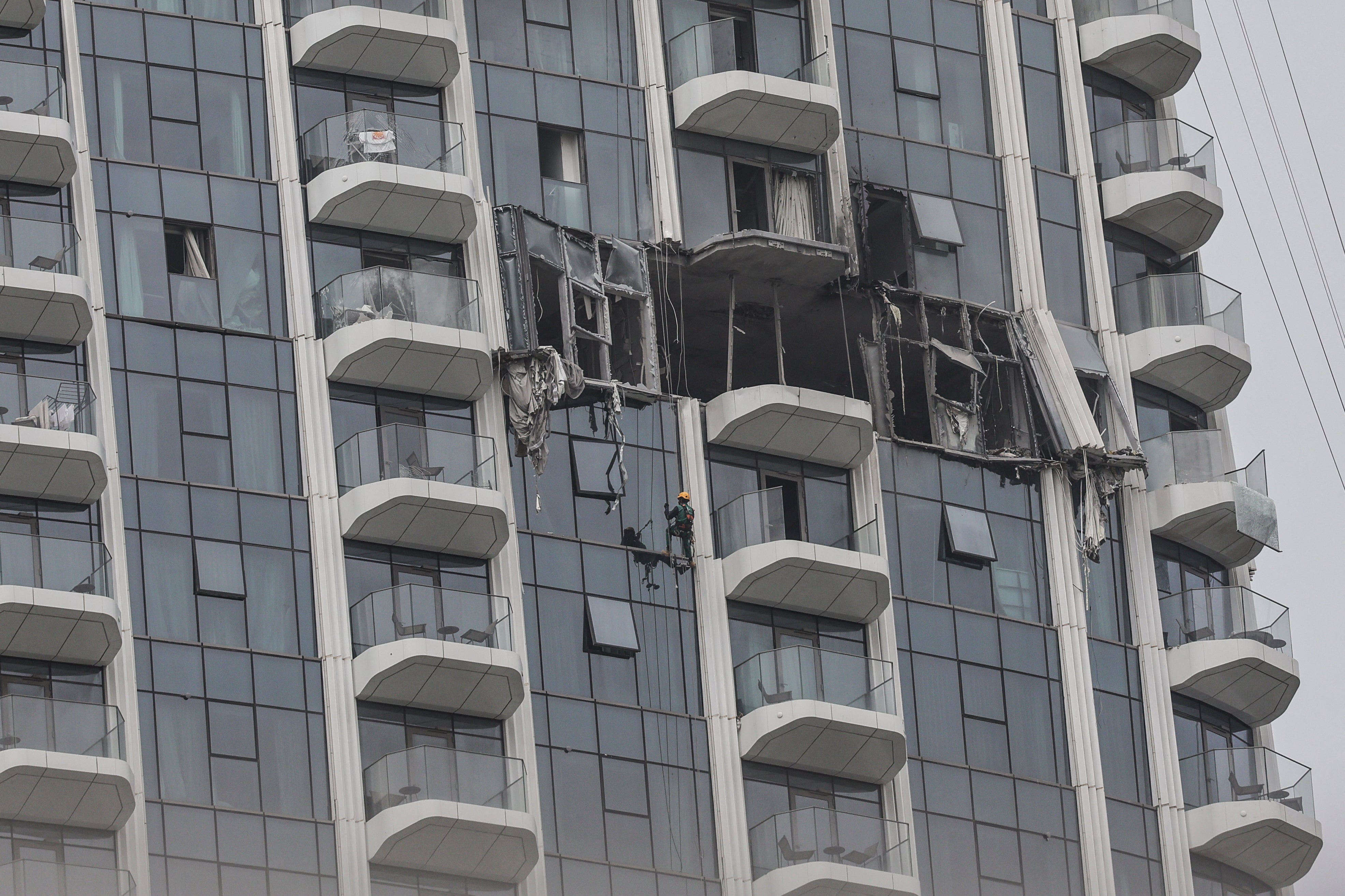 The impact of a drone attack on a Dubai apartment building