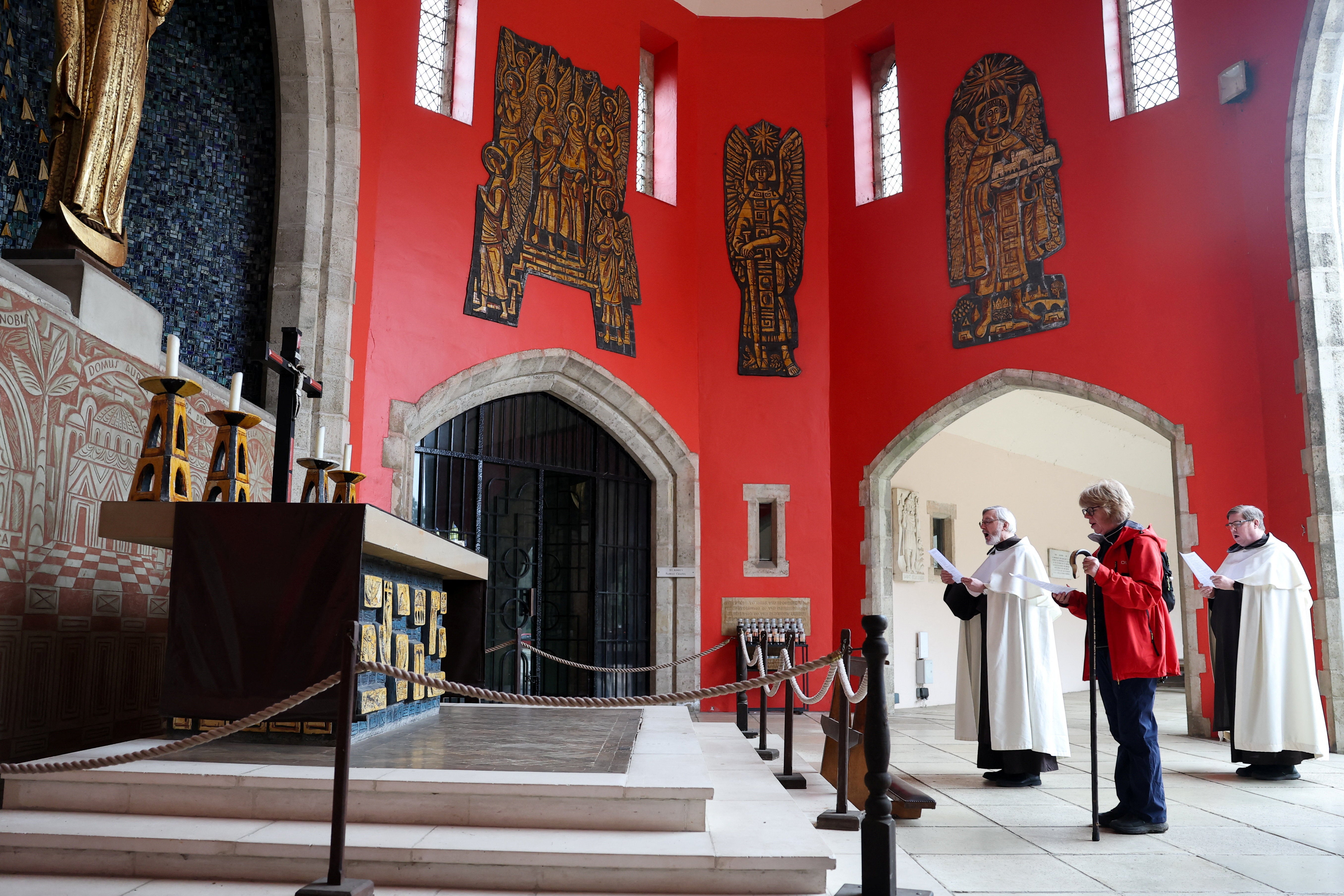 Archbishop of Canterbury Sarah Mullally takes part in a prayer at the Aylesford Priory next to Father Gerard and Father Michael Cox