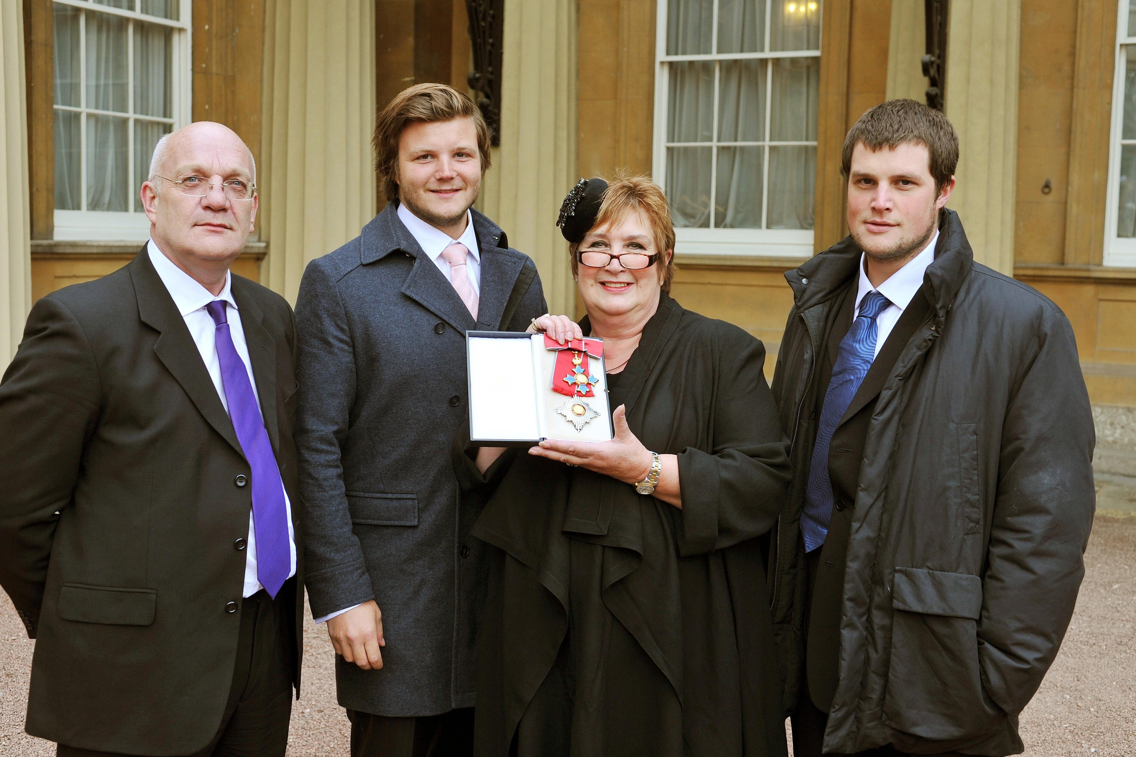 Dame Jenni Murray in 2011 with (from left) her husband David and sons Charlie and Ed (PA Archive)