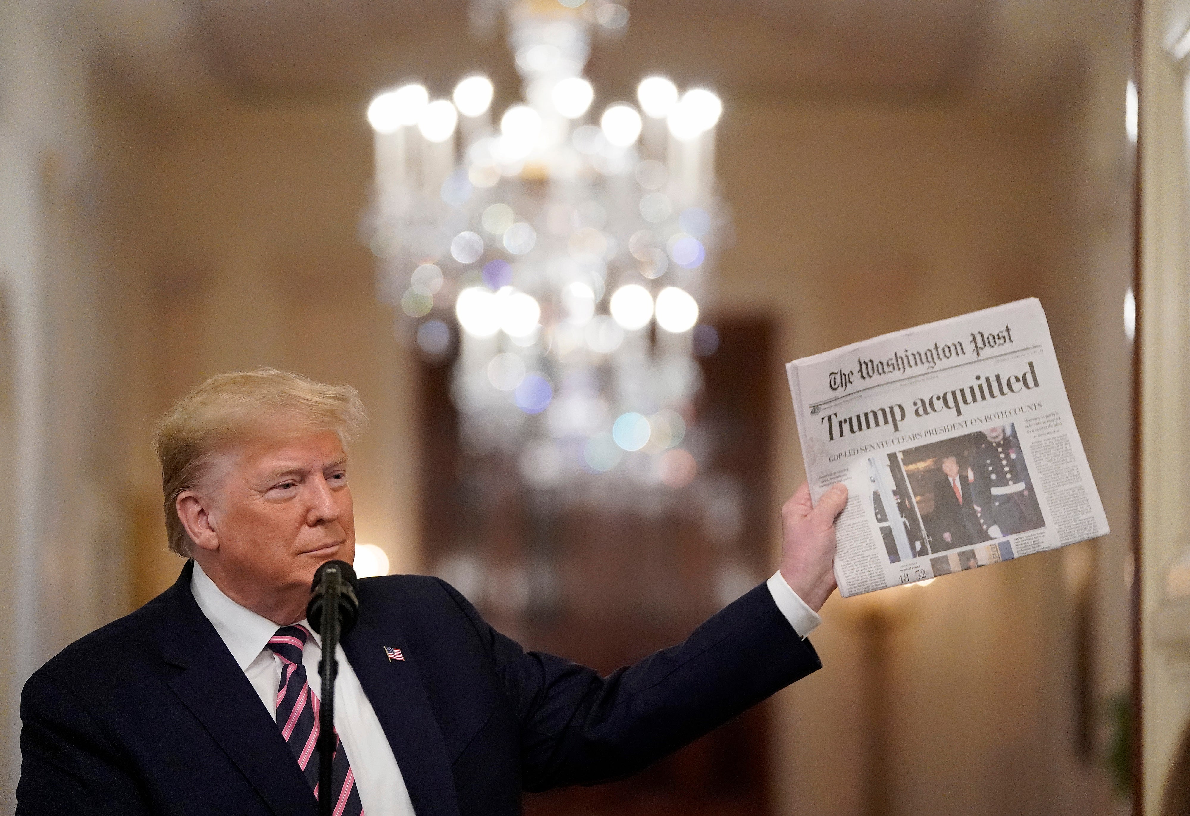 Trump was impeached twice during his first term, with the Senate acquitting him on both occasions. He is pictured here holding a copy of The Washington Post the day after the Senate acquitted him on two articles of impeachment in February 2020