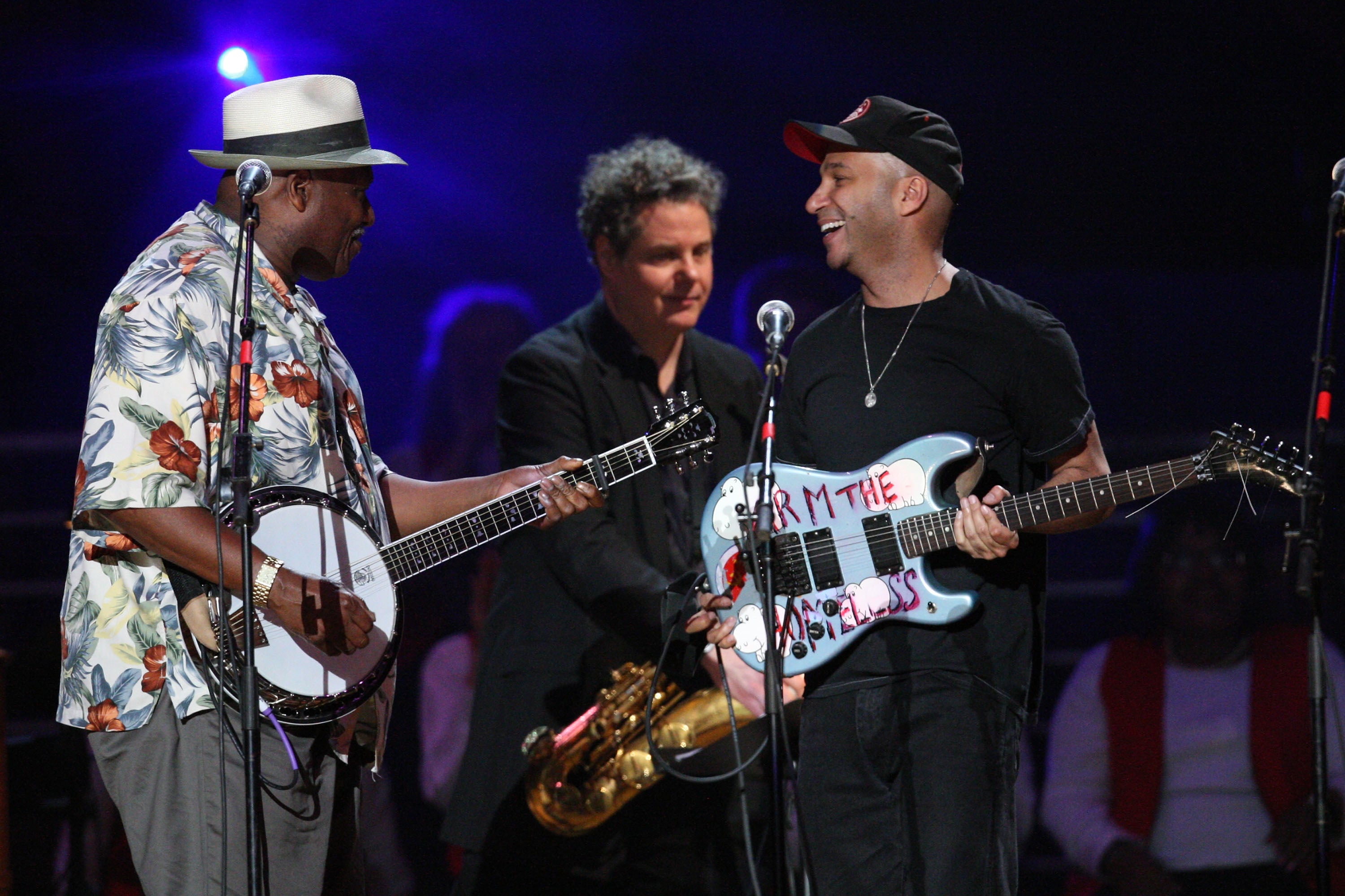 Taj Mahal, pictured with Rage Against The Machine’s Tom Morello at Pete Seeger’s 90th birthday celebration, says he almost became a farmer: ‘Music came and got me!’